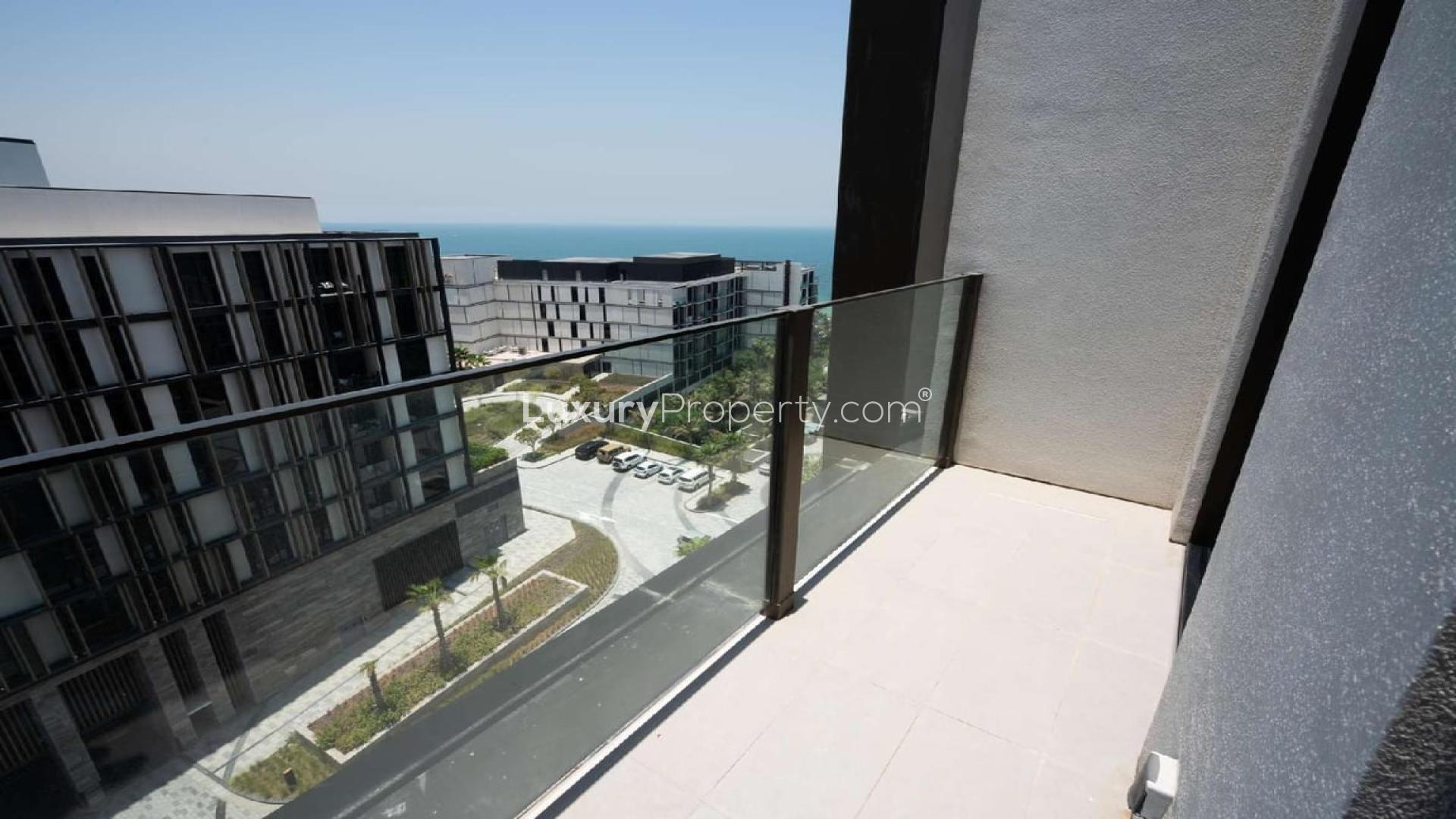 Modern kitchen in furnished apartment at Caesars Bluewaters Dubai, with sleek design and lighting