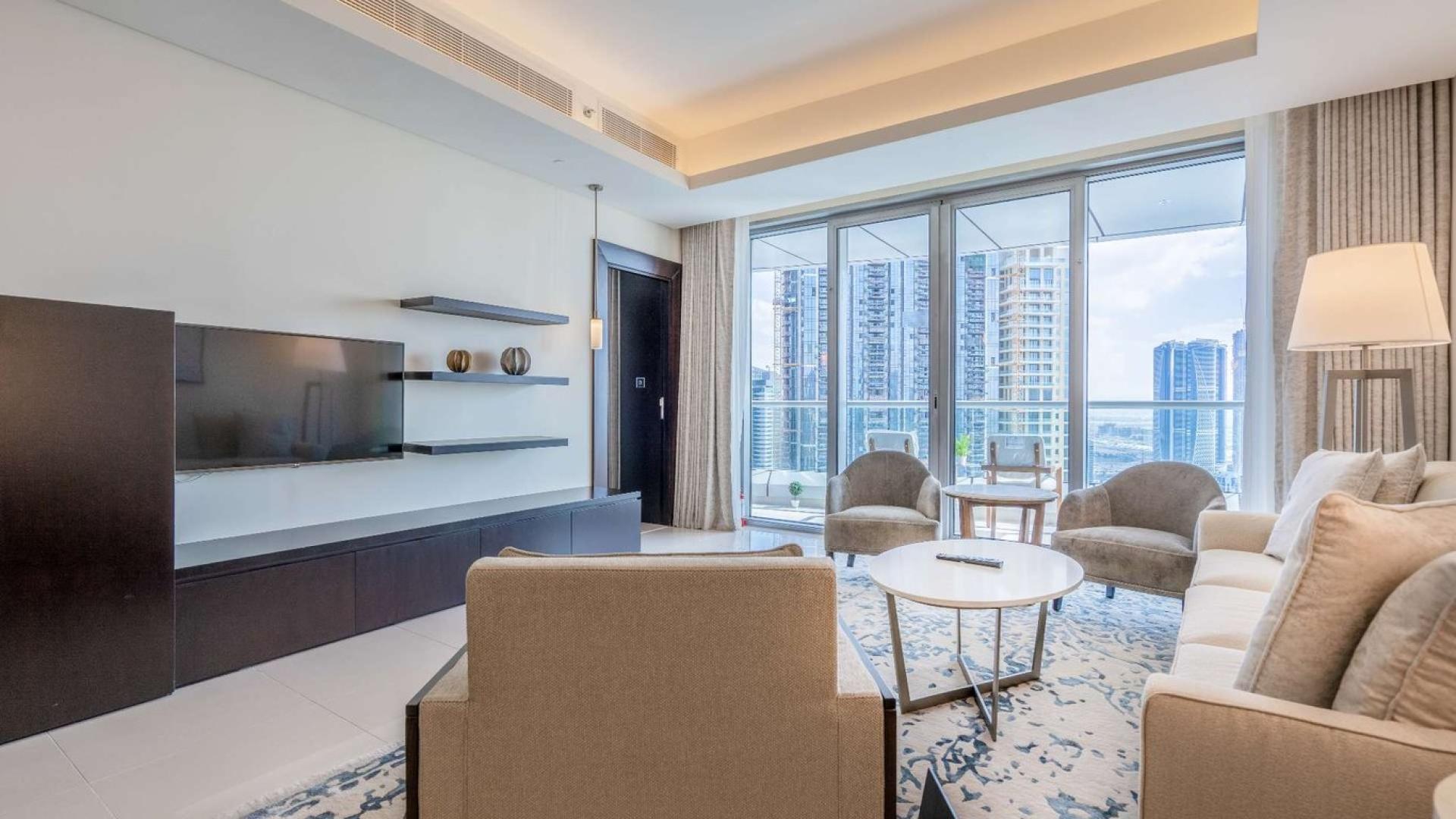 Luxurious Downtown Dubai apartment living room with modern decor and elegant furnishings