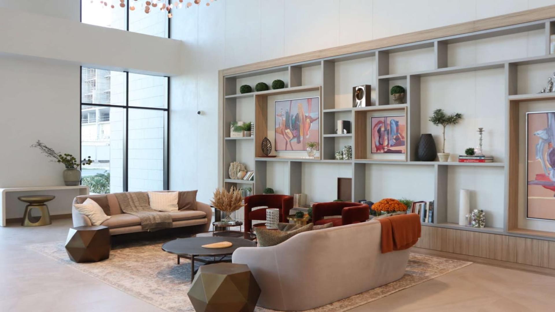 "Elegant lobby in Wilton Terraces, MBR City apartment, featuring modern decor and cozy seating.",High-floor Wilton Terraces apartment living room, modern decor, spacious seating, MBR City rental