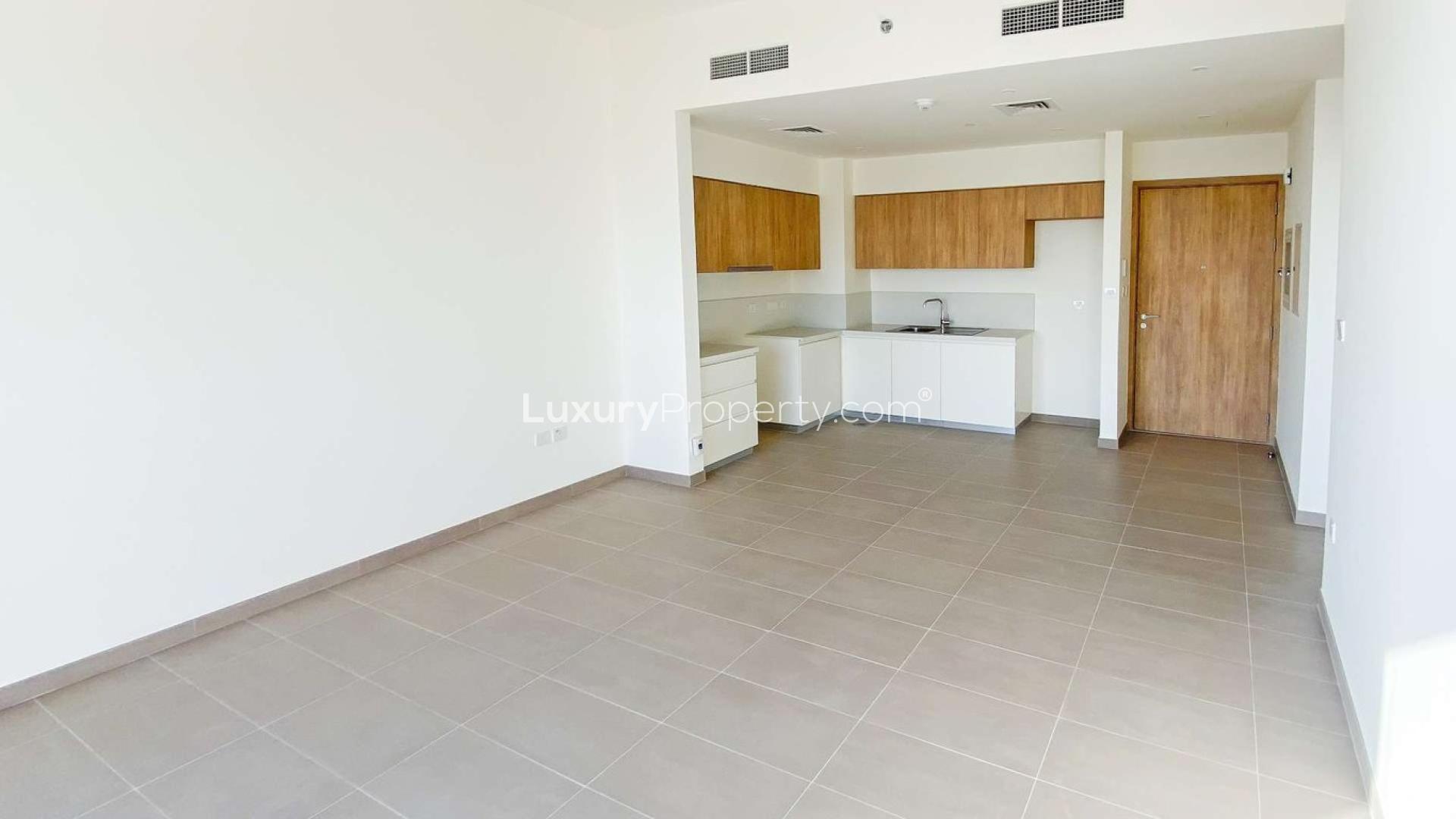 Balcony view from 1-bedroom apartment in Park Ridge, Dubai Hills Estate, overlooking cityscape and roads