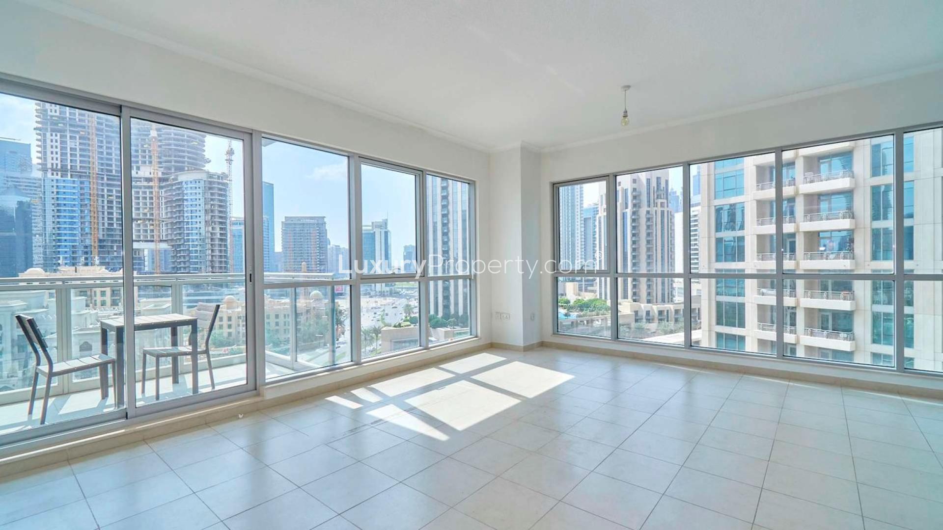 Bright living room with city view in Downtown Dubai apartment, The Residences