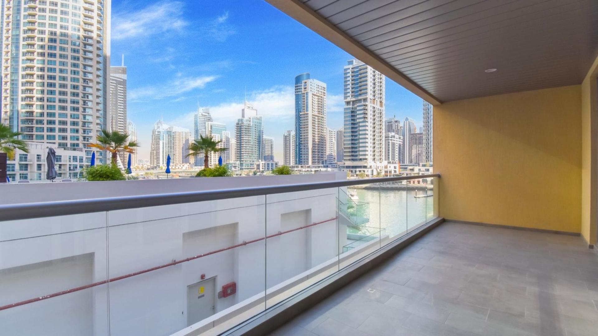 Rooftop pool view of Dubai Marina skyline from JAM Marina Residence apartment for rent