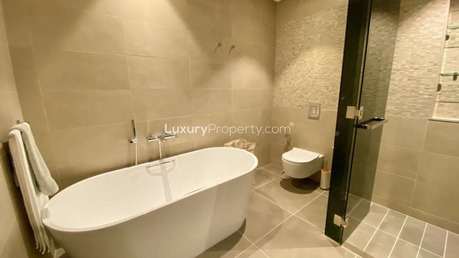 Modern living room in luxury Dubai Marina apartment, Marina Gate, with city view