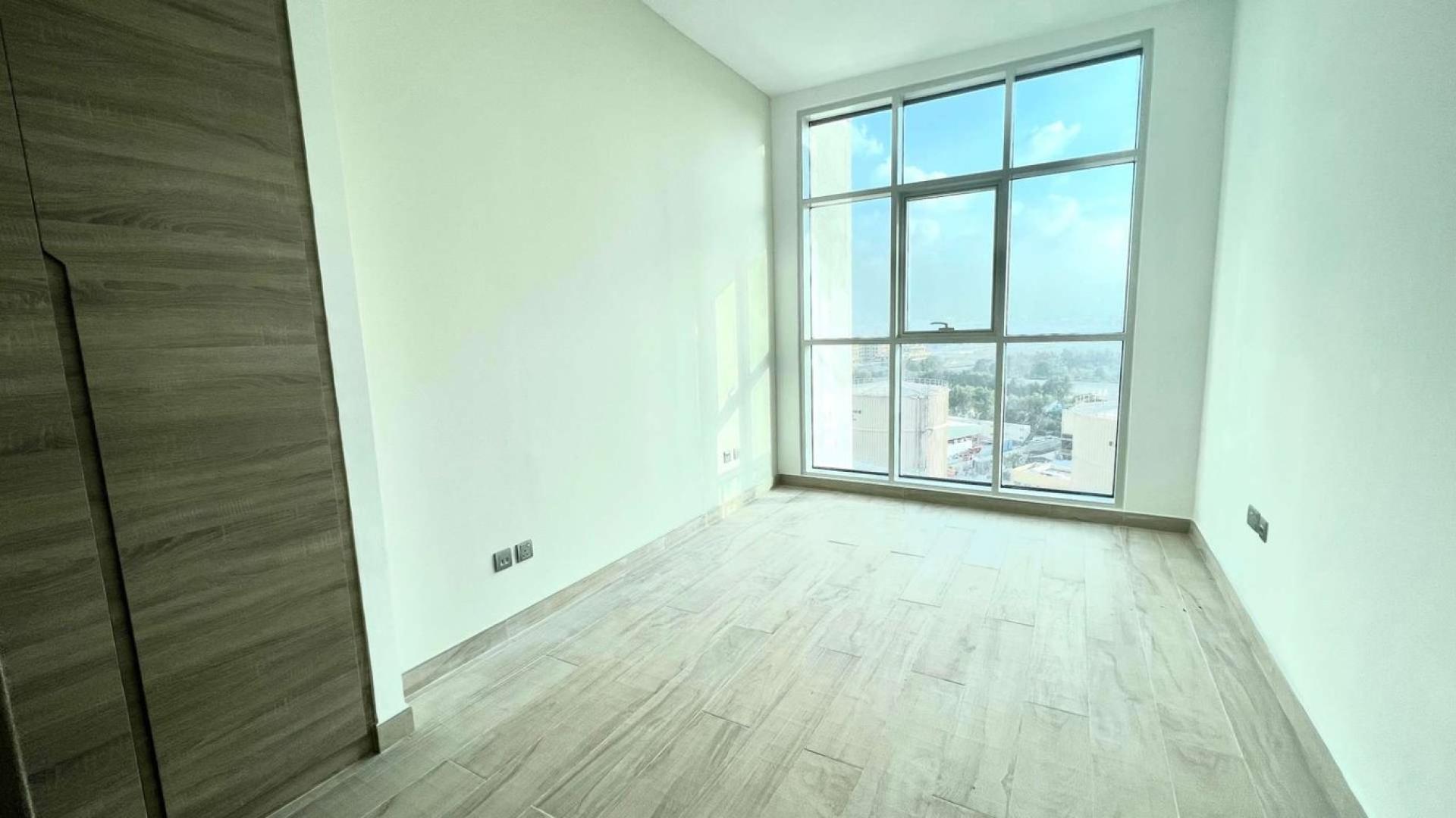 Modern kitchen and living area in luxury 1-bedroom apartment, Studio One, Dubai Marina