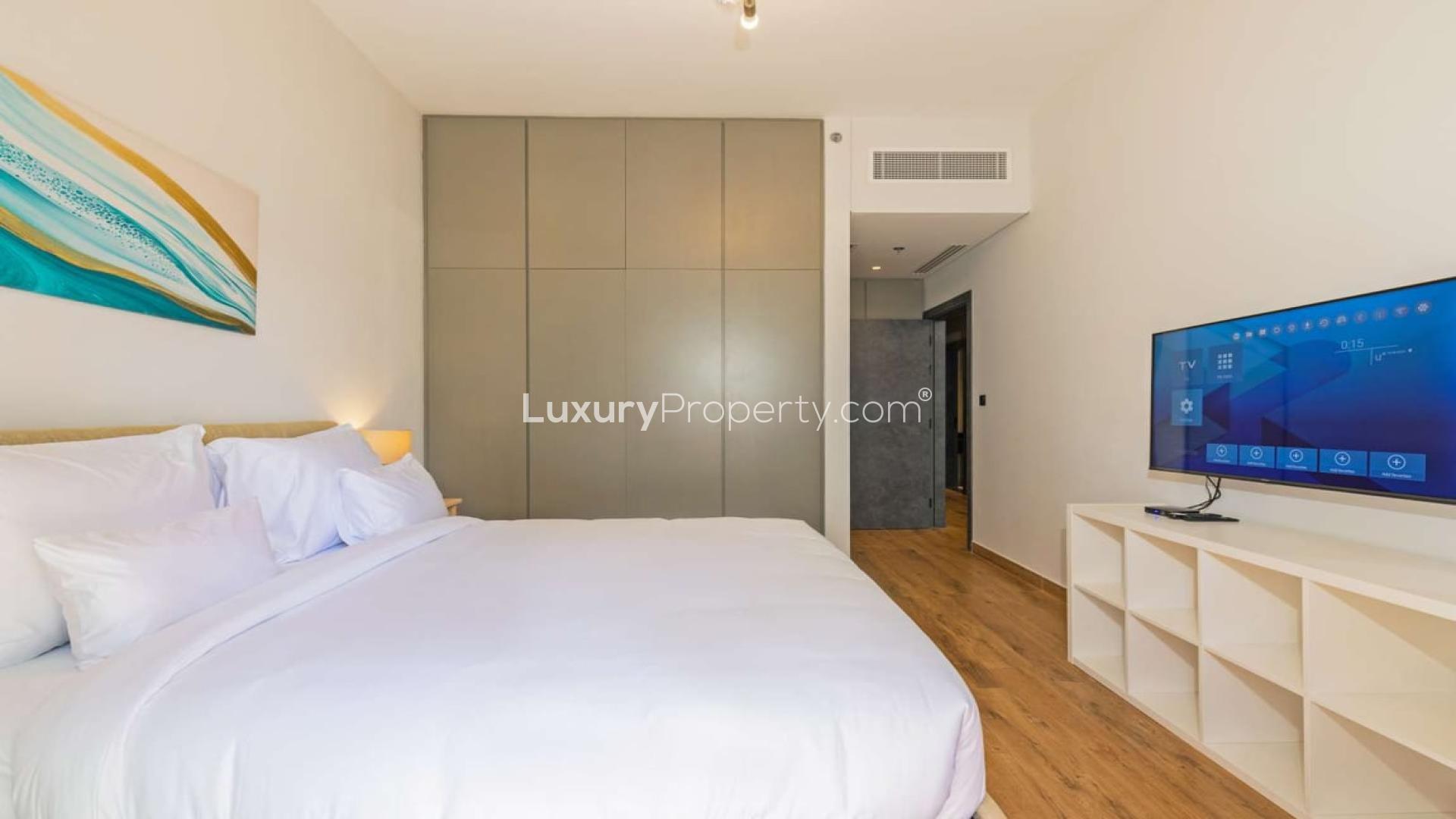 Living area in 1-bedroom apartment, Marina Moon Tower, Dubai Marina, modern decor, wooden flooring