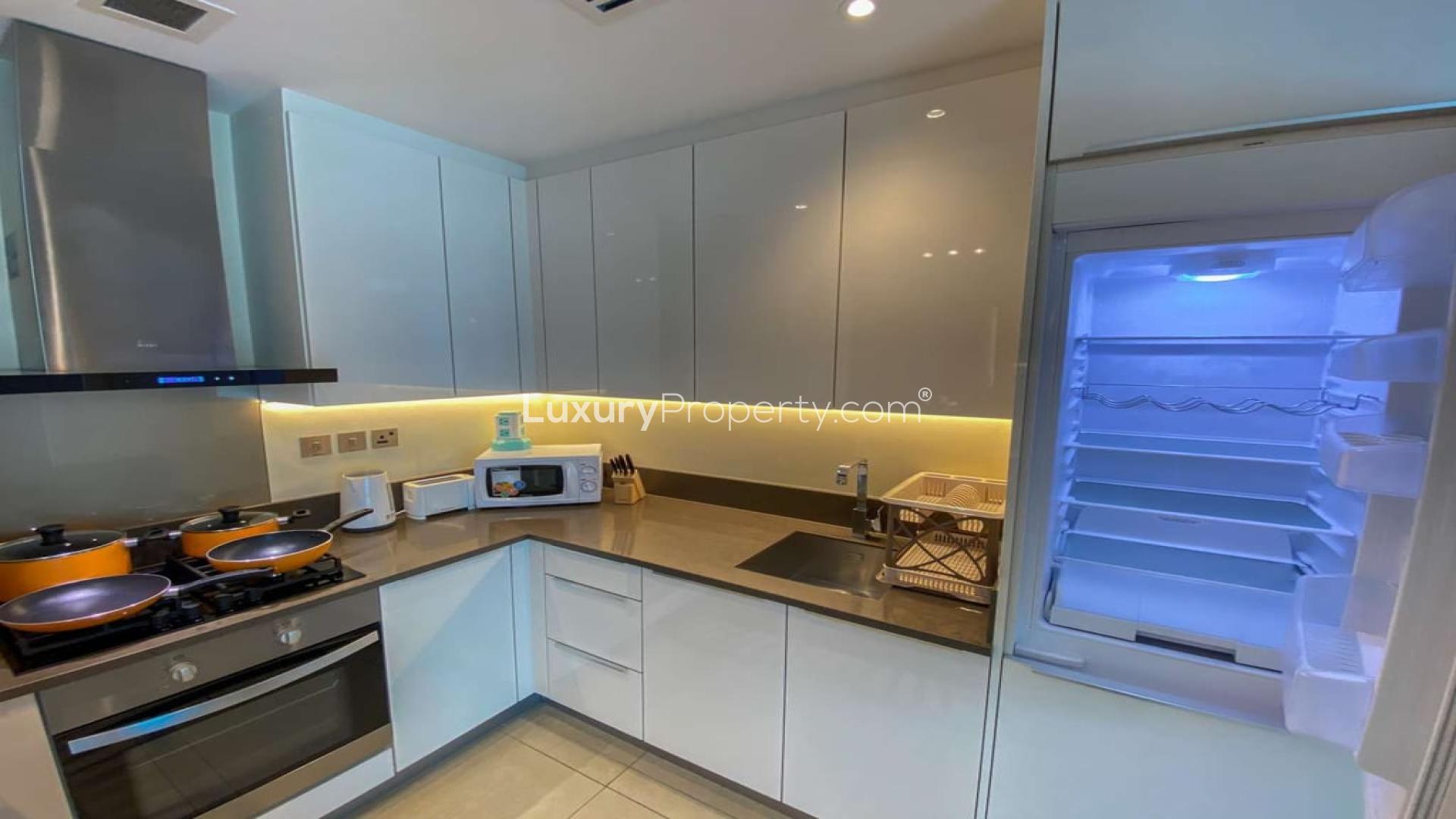 Modern living room in Marina Gate apartment, Dubai Marina, featuring stylish decor and large windows