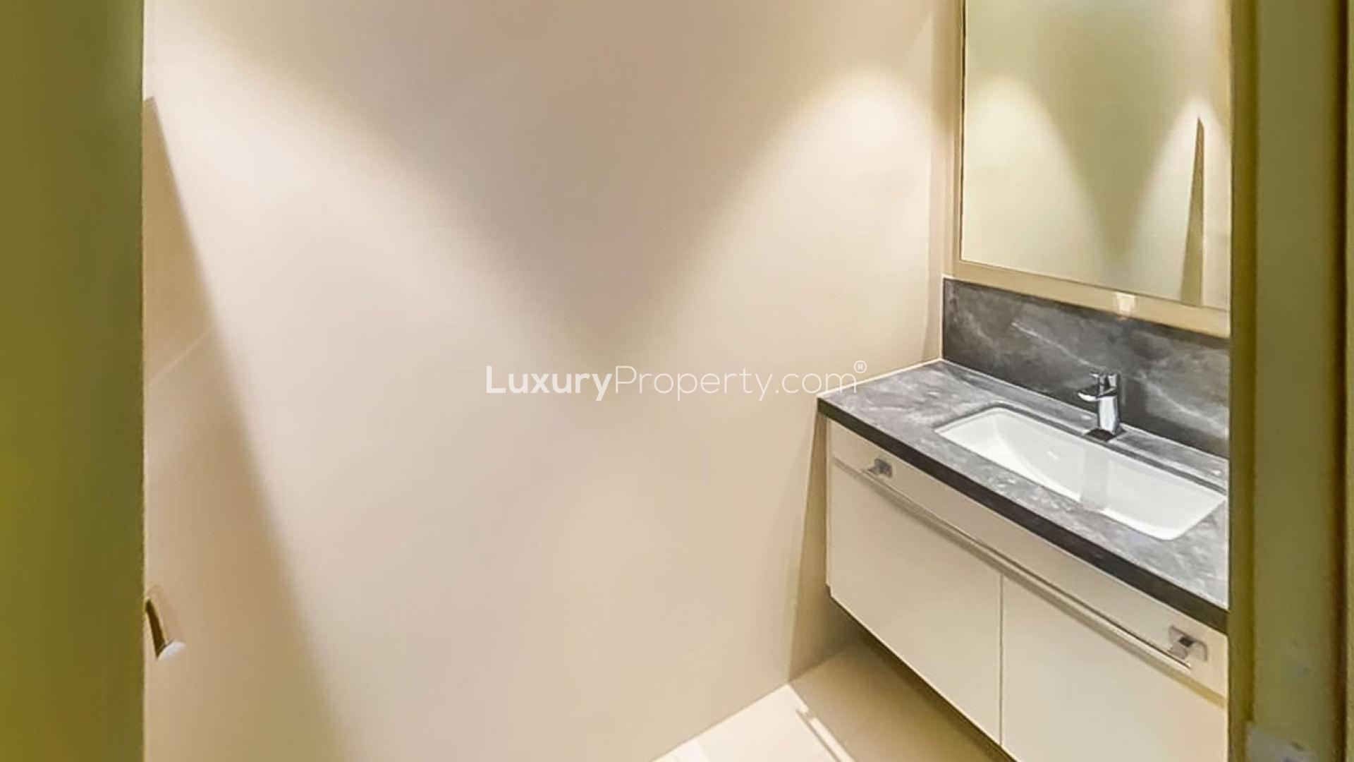 Fully furnished living room in 1-bedroom apartment, Downtown Dubai, with modern decor and balcony view