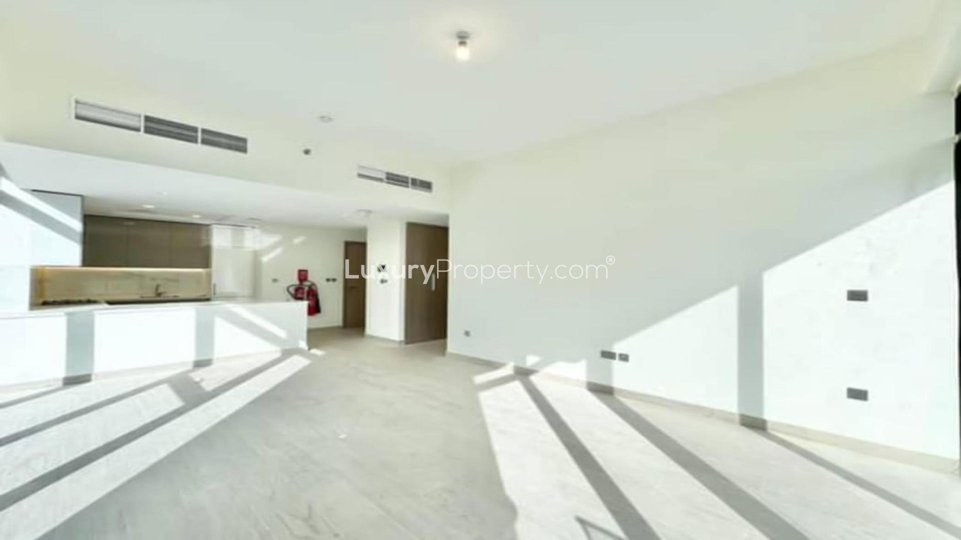 Brand new partly furnished apartment kitchen with large windows in Meydan One, vacant for rent