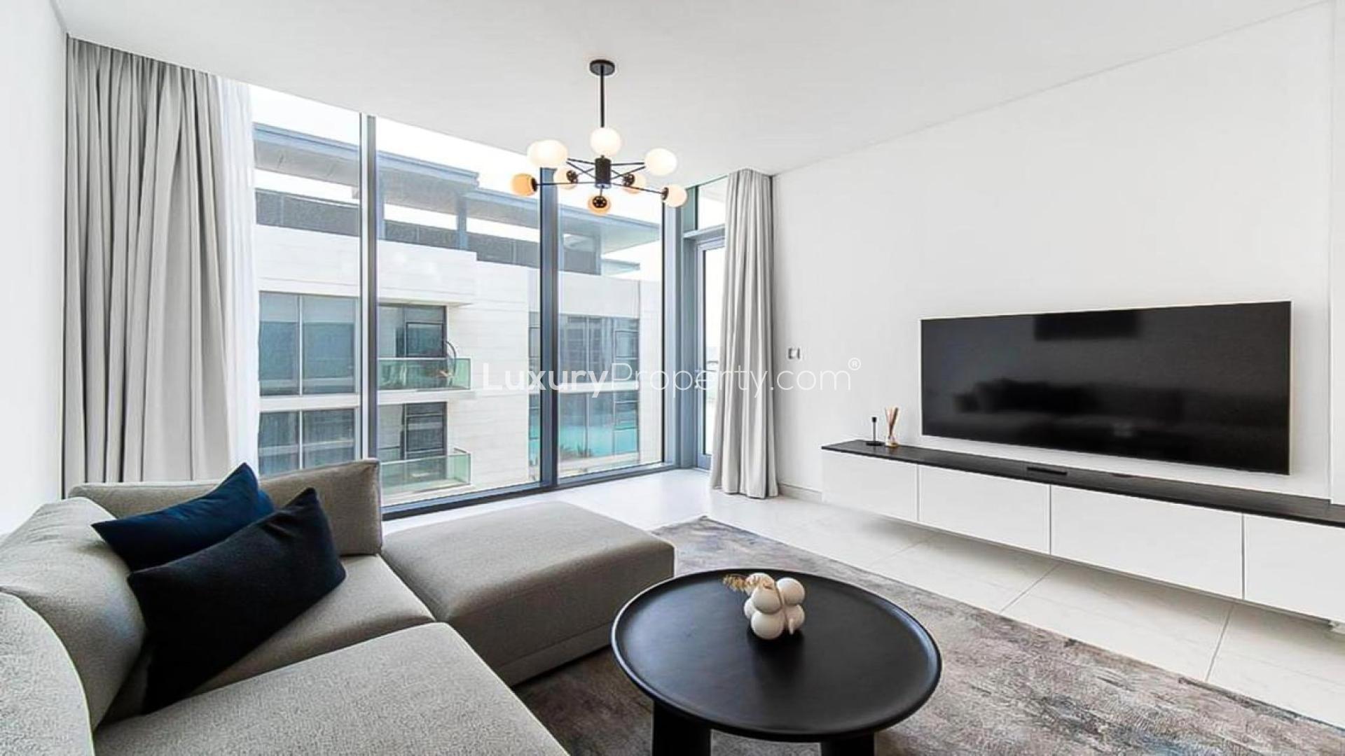 Modern living room in District One apartment with large window and stylish decor