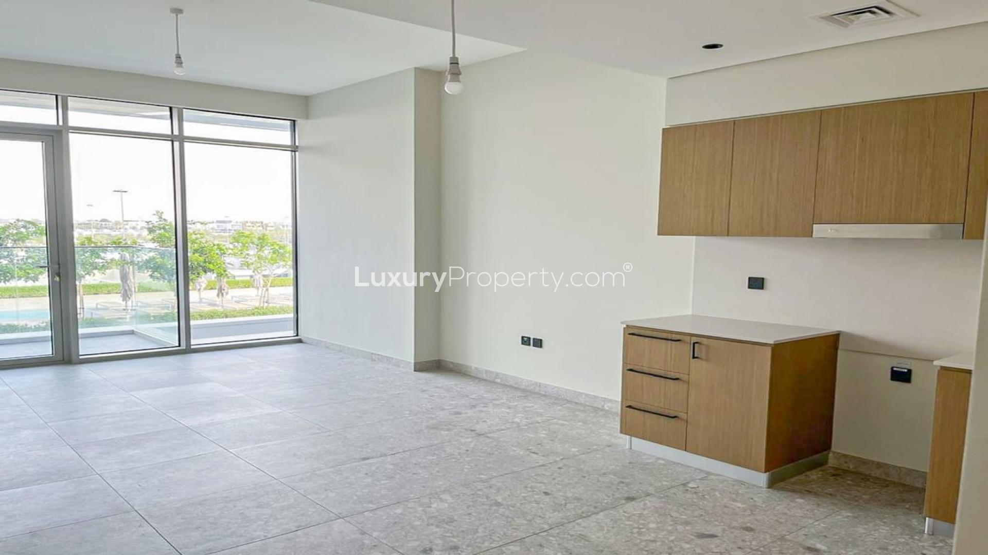 Modern kitchen in 1-bedroom apartment, Dubai Hills Estate, with spacious layout and sleek cabinets