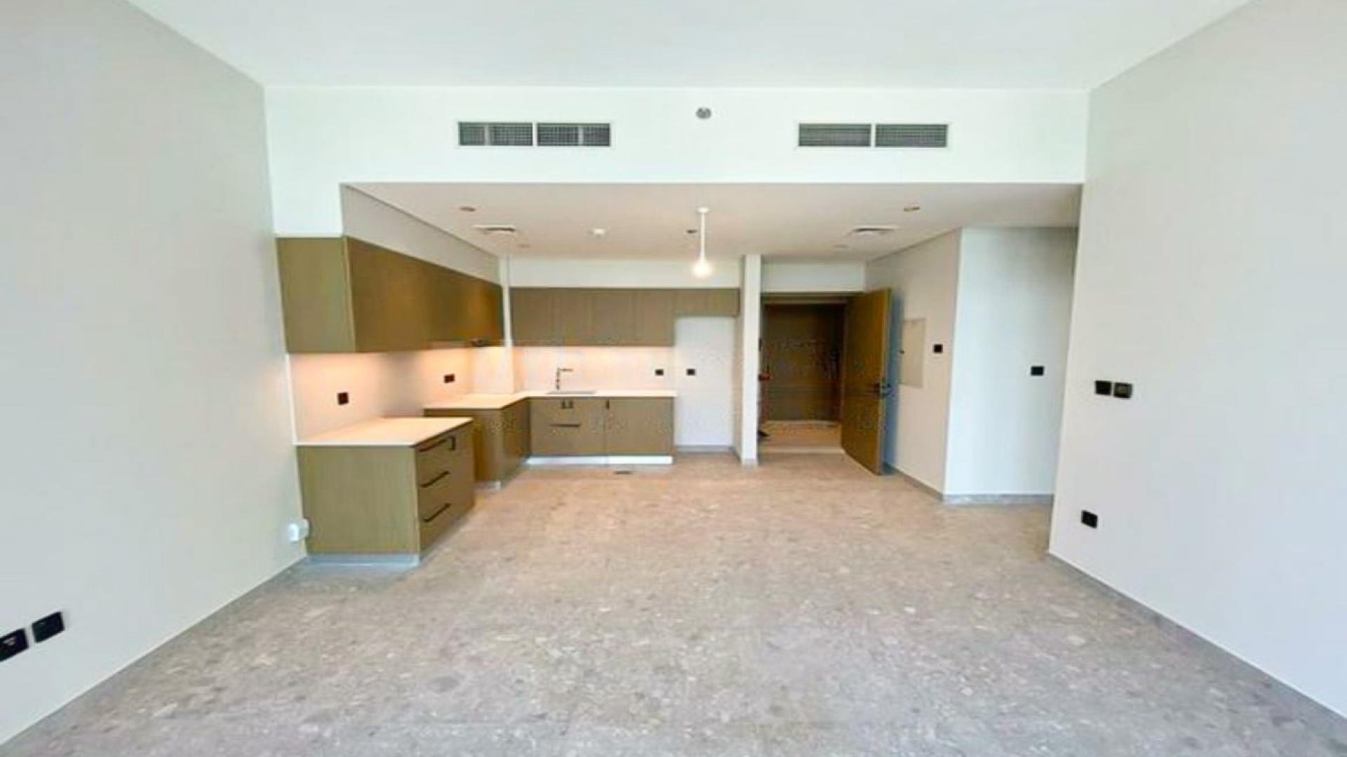 Modern apartment interior with golf course and pool view in Dubai Hills Estate