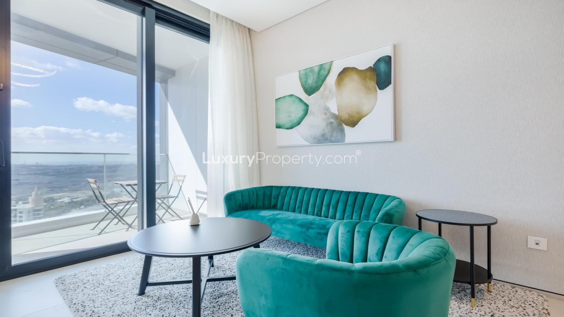 Furnished living room with balcony view in The Address Jumeirah Resort apartment