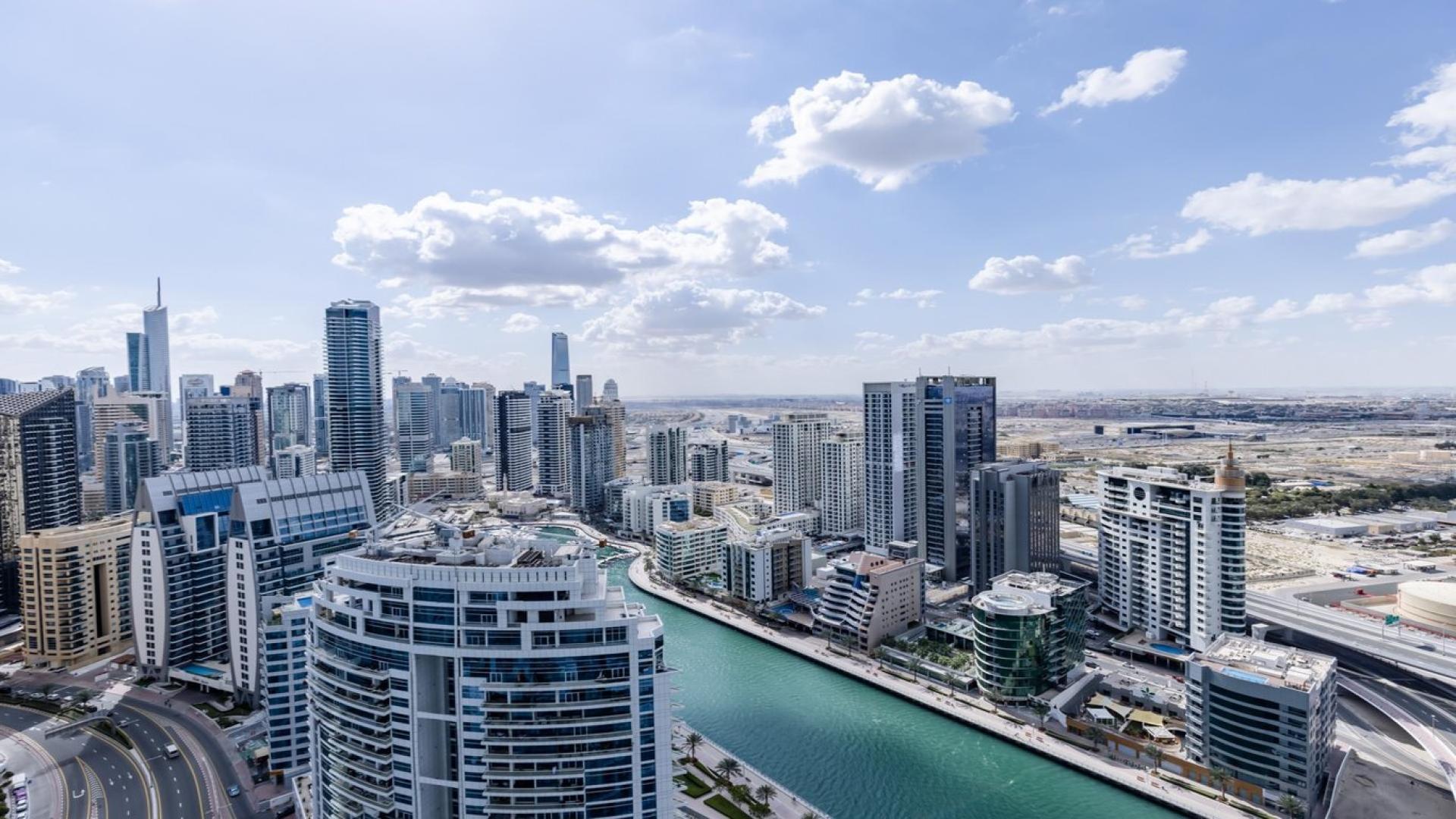 Furnished living room with marina views in The Address Jumeirah Beach Residence apartment