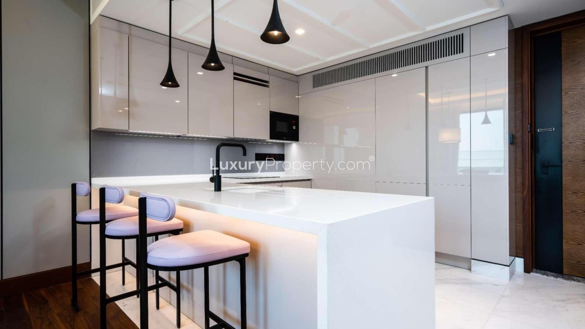 Skyline view from luxury apartment at Caesars Palace Bluewaters Dubai, featuring modern architecture