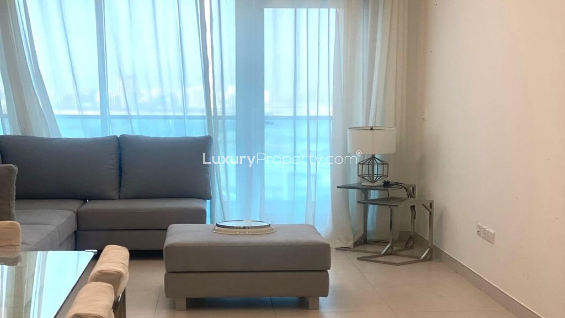 Furnished Business Bay apartment with modern living room, dining area, and large windows