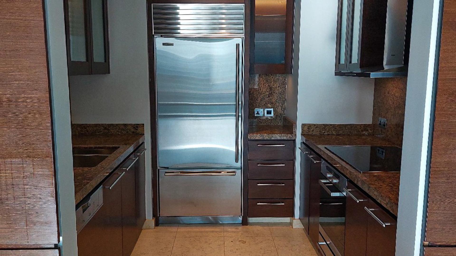 Empty high-floor apartment interior with large windows, Downtown Dubai, Burj Khalifa views