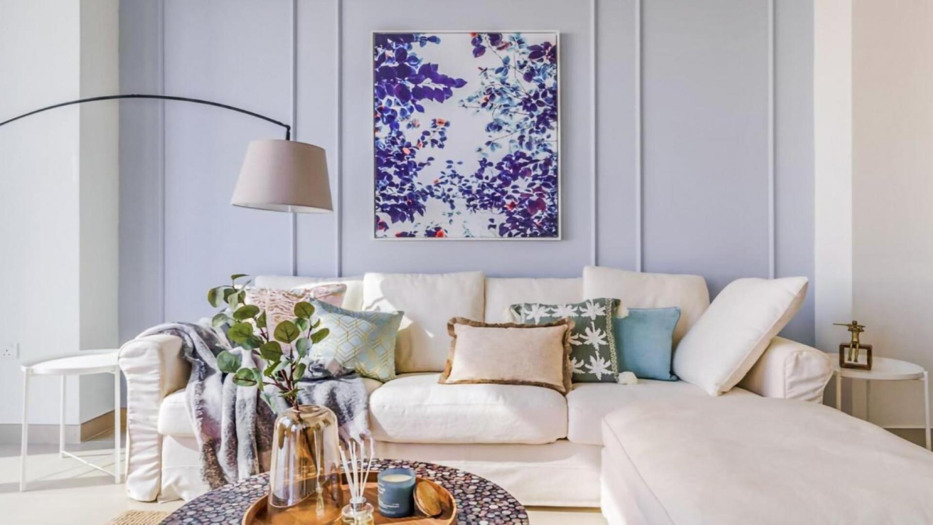 Modern living room in 1-bedroom apartment, Dubai Marina, featuring cozy sofa and elegant decor