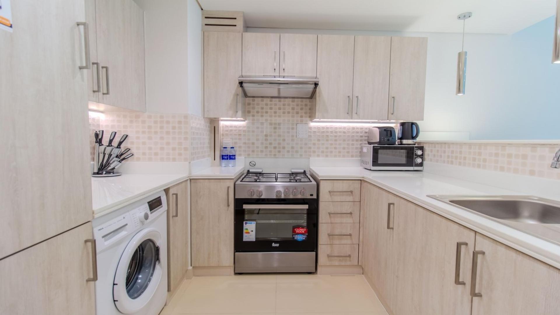 Modern kitchen and dining area in luxury 1-bedroom apartment, Seven Palm, Palm Jumeirah