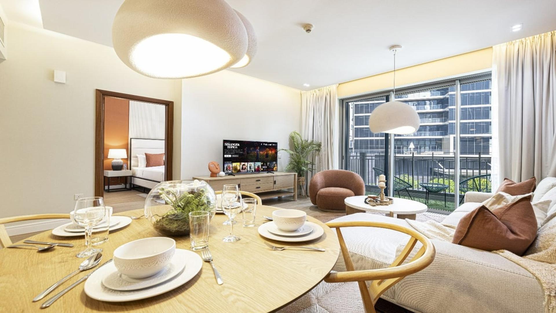 Furnished living room in Standpoint Towers apartment, Downtown Dubai, with modern decor and dining area