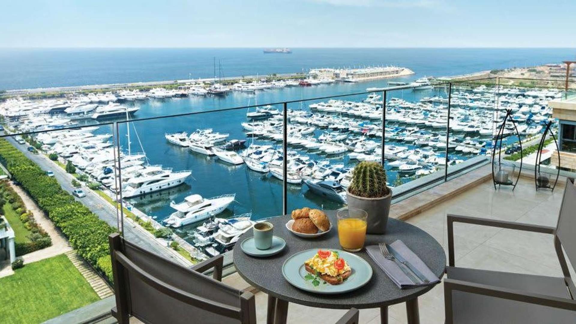 Modern entrance of waterfront apartment at Beachside Residences, Tilal Al Ghaf, for sale