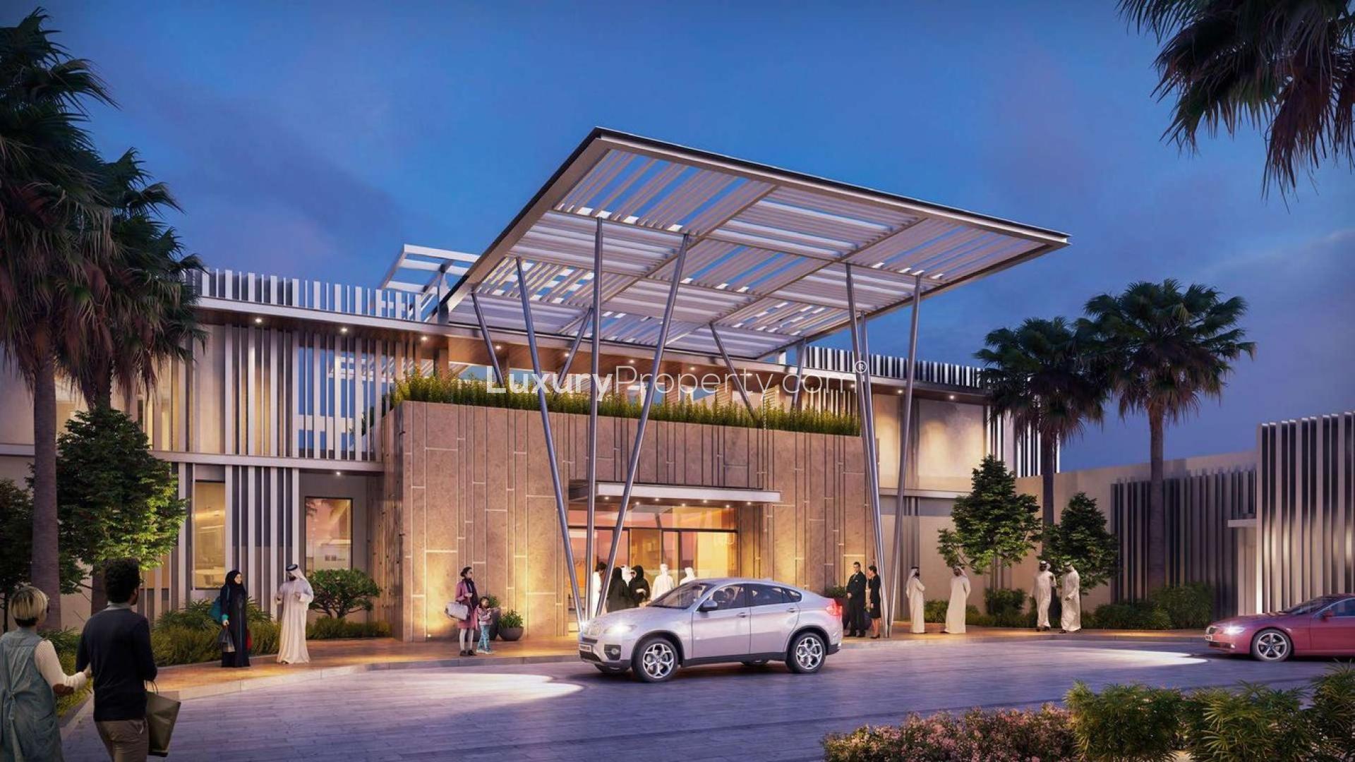 "Modern entrance of Beachside Residences 3 apartment in Tilal Al Ghaf for sale.",Modern entrance of Beachside Residences 3, Tilal Al Ghaf, evening view with palm trees