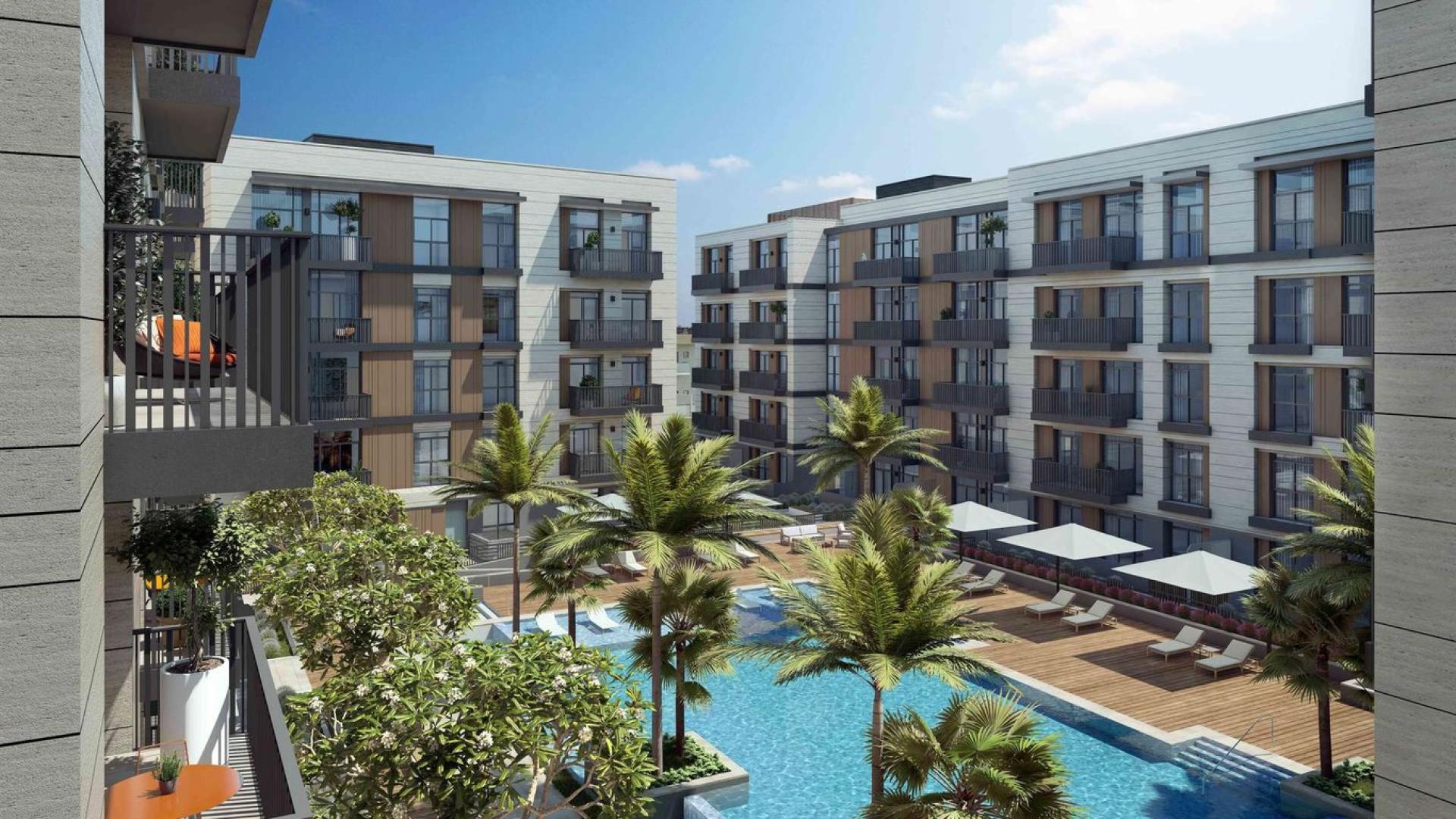 Contemporary living room in 1-bedroom apartment, Belgravia Square, JVC Dubai, modern decor, natural light