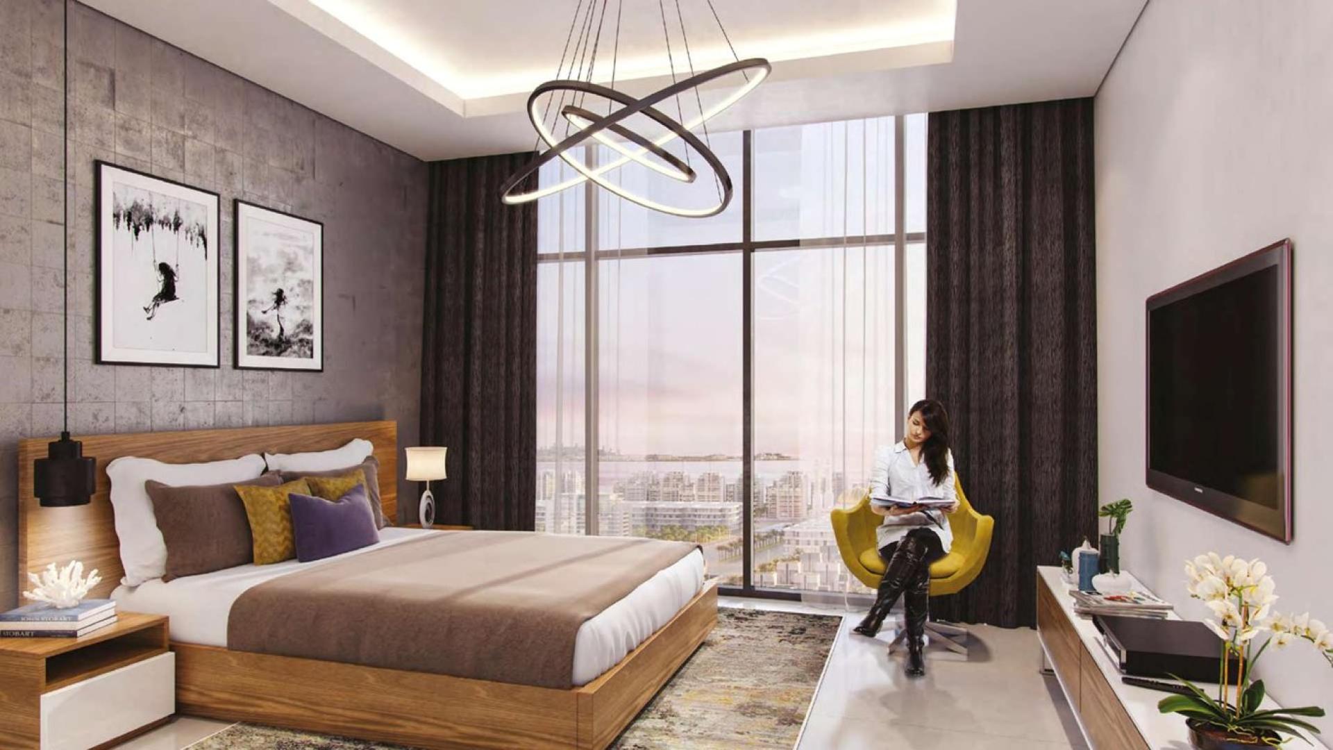 Luxurious lobby at Riviera Meydan One apartment for sale, featuring modern wood and marble design