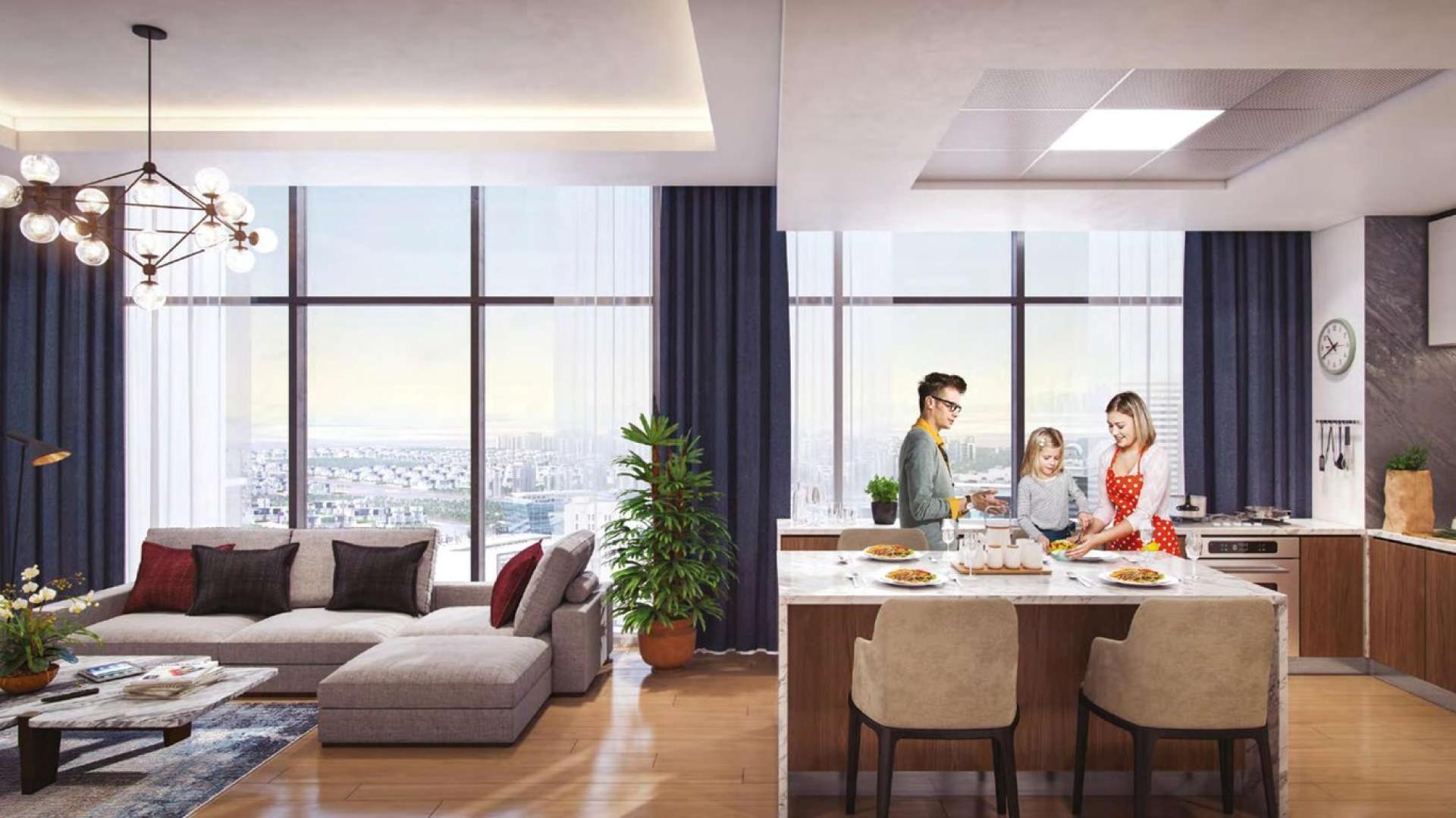 Modern living area in Azizi Riviera 26 apartment, Meydan One, featuring open kitchen and decor