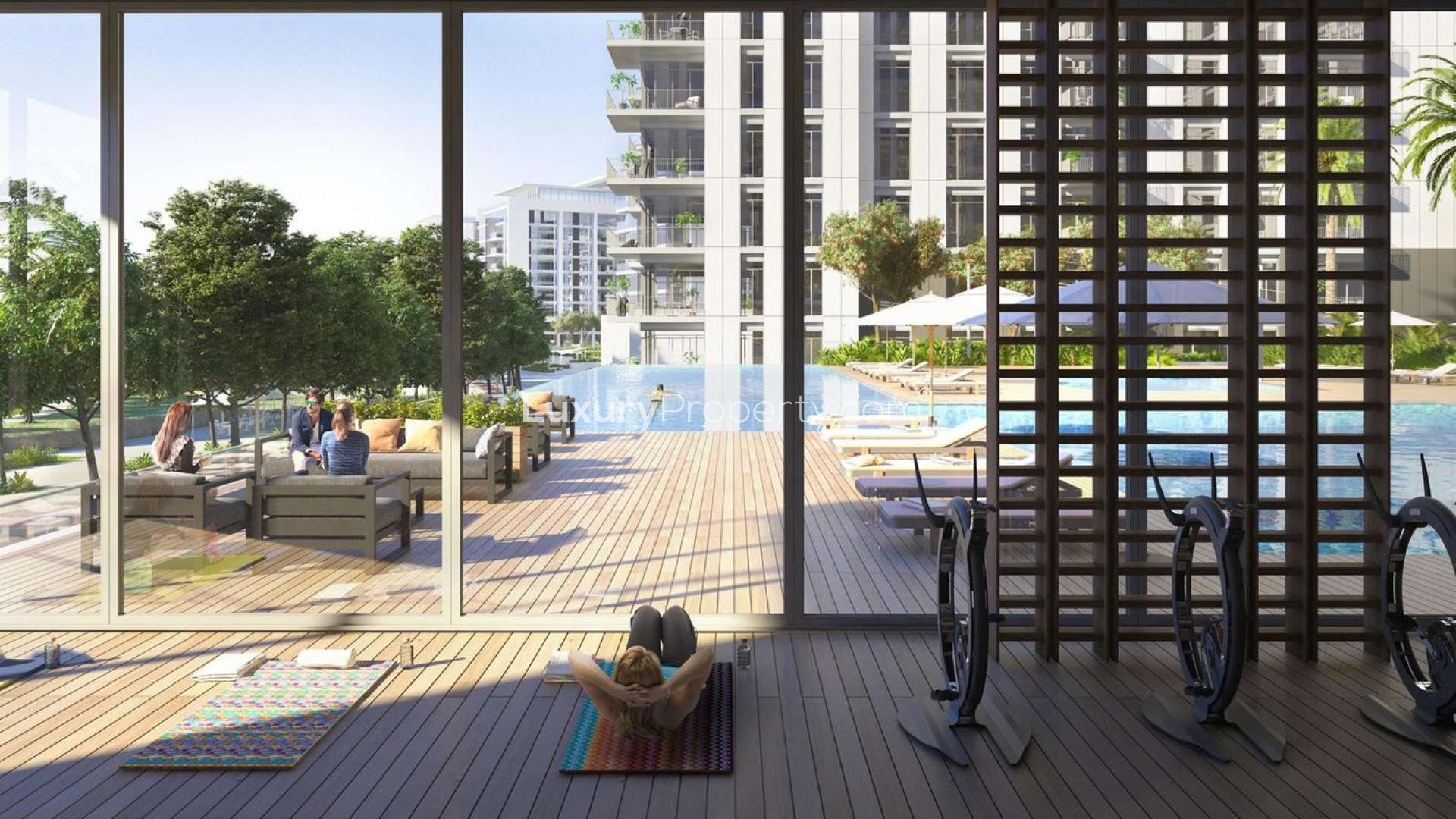 Modern living room and kitchen in Park Ridge one-bedroom apartment, Dubai Hills Estate