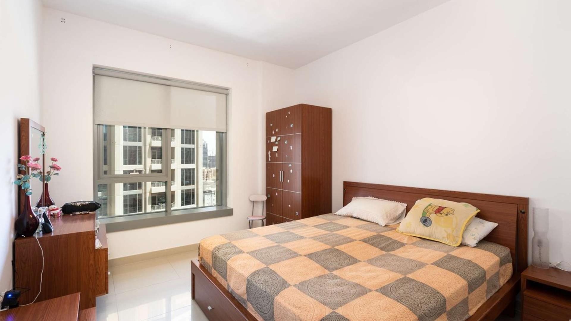 Living room in Downtown Dubai apartment with large windows and modern decor