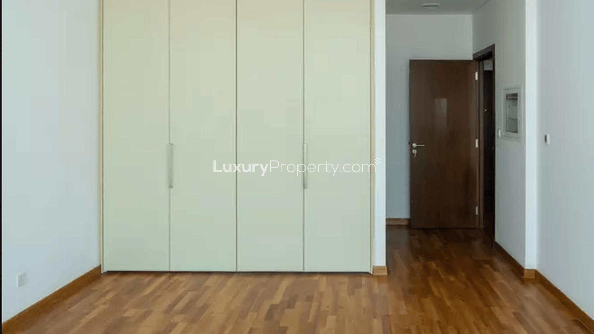 Balcony view from 1-bedroom apartment in Burj Daman, DIFC, overlooking cityscape and greenery