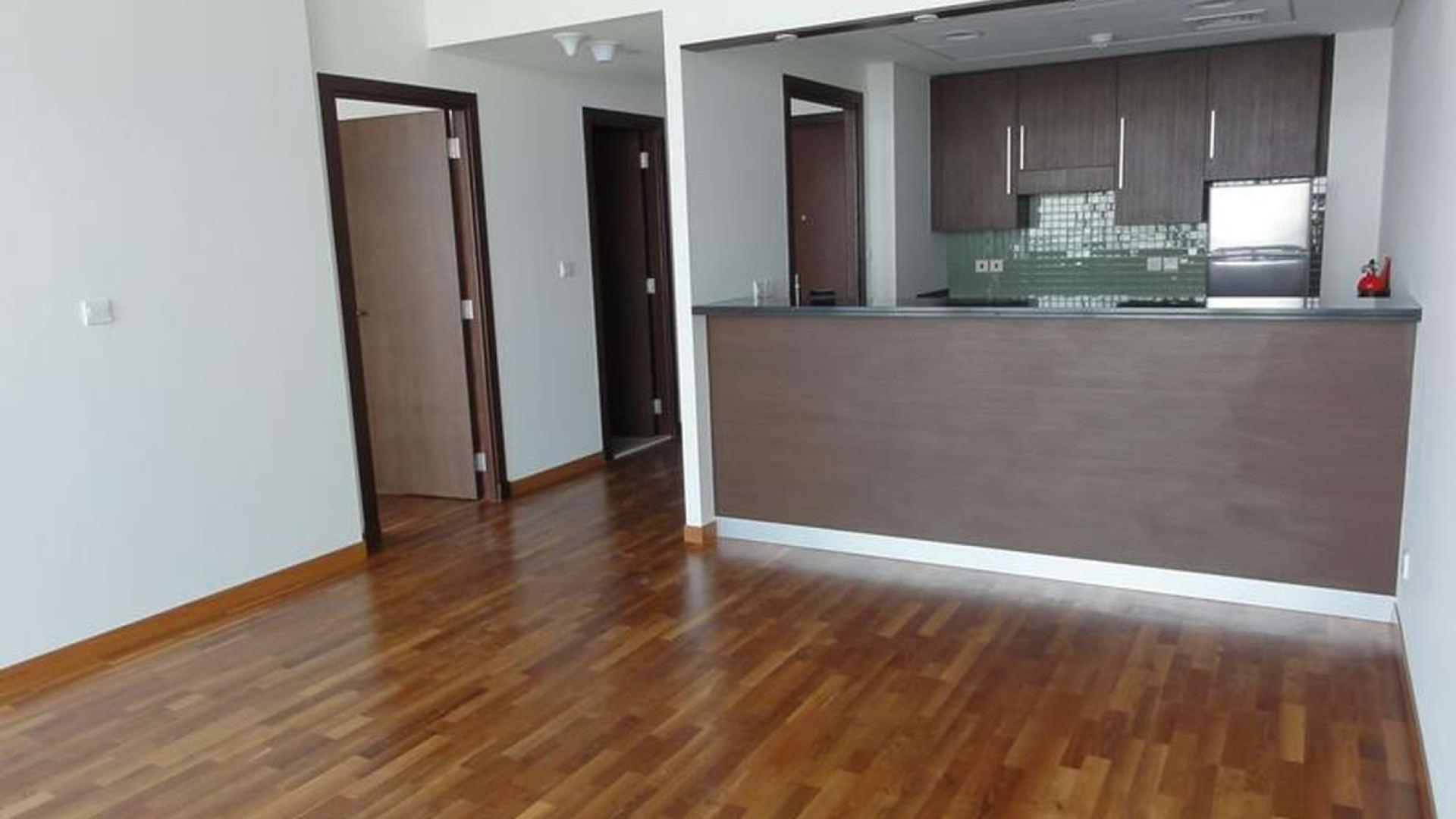 Balcony view from 1-bedroom apartment in Burj Daman, DIFC, overlooking city skyline