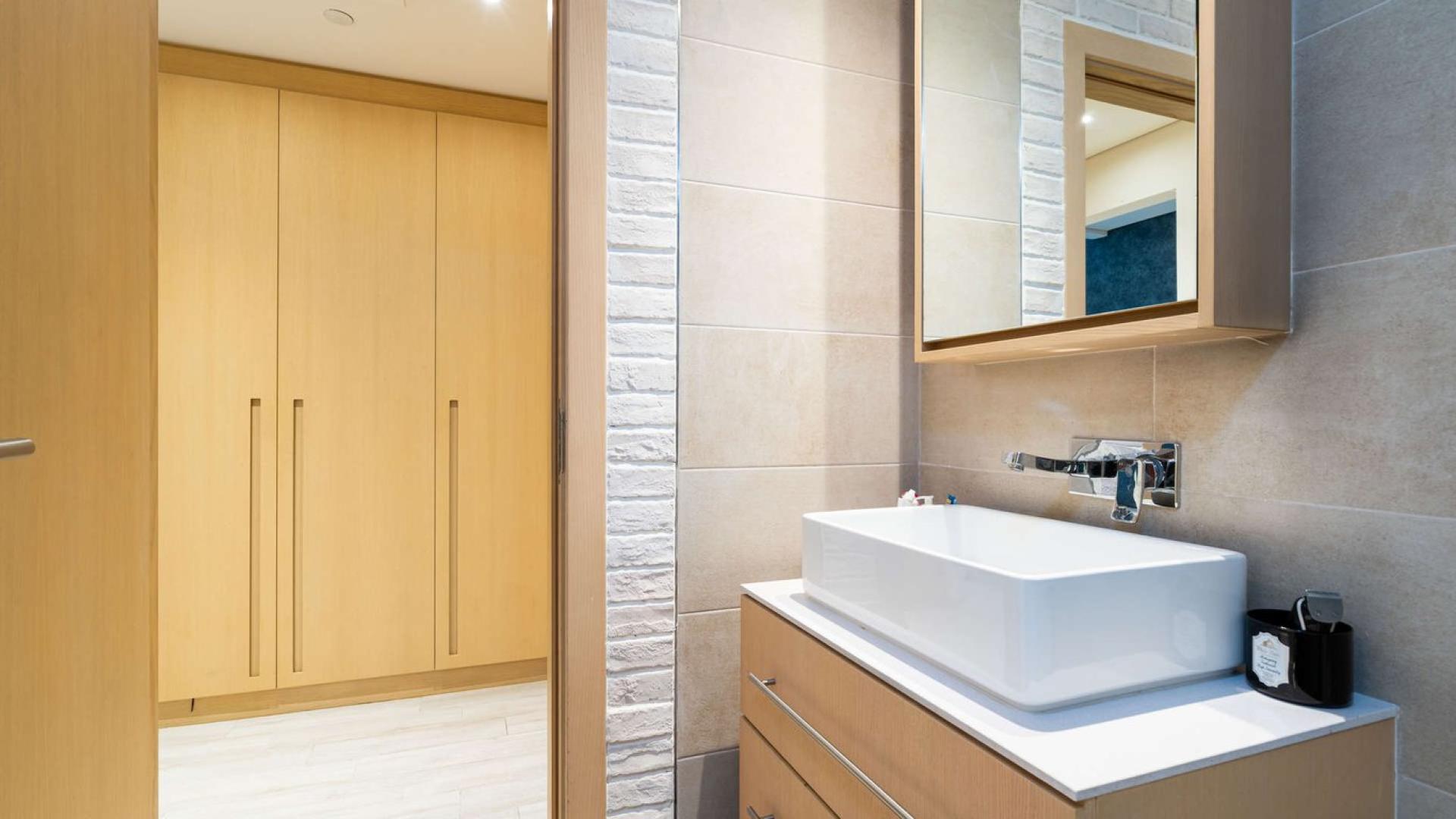 Modern living room in spacious 1-bedroom apartment, Belgravia 1, JVC, with stylish decor and balcony