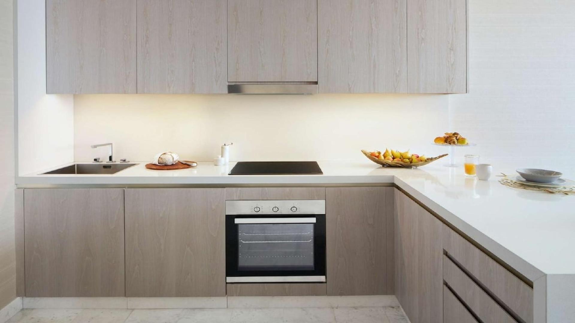 Modern kitchen and living area in one-bedroom apartment, The Palm Tower, Palm Jumeirah