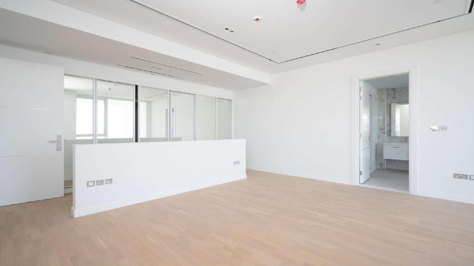 Modern kitchen with island and Burj views in Seventh Heaven, Al Barari apartment