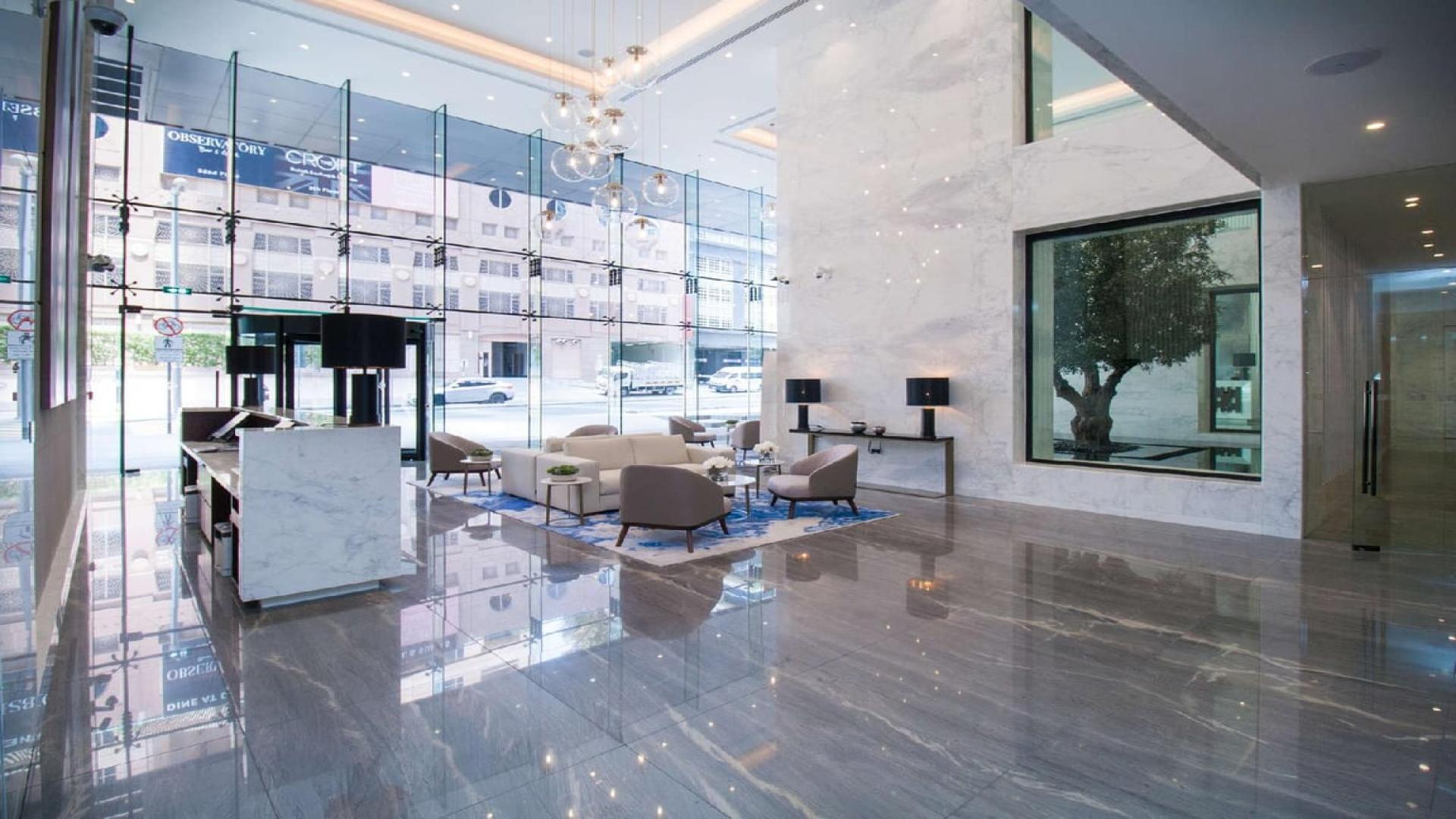 Spacious lobby at Marina Gate apartment, Dubai Marina, featuring modern design and luxurious finishes