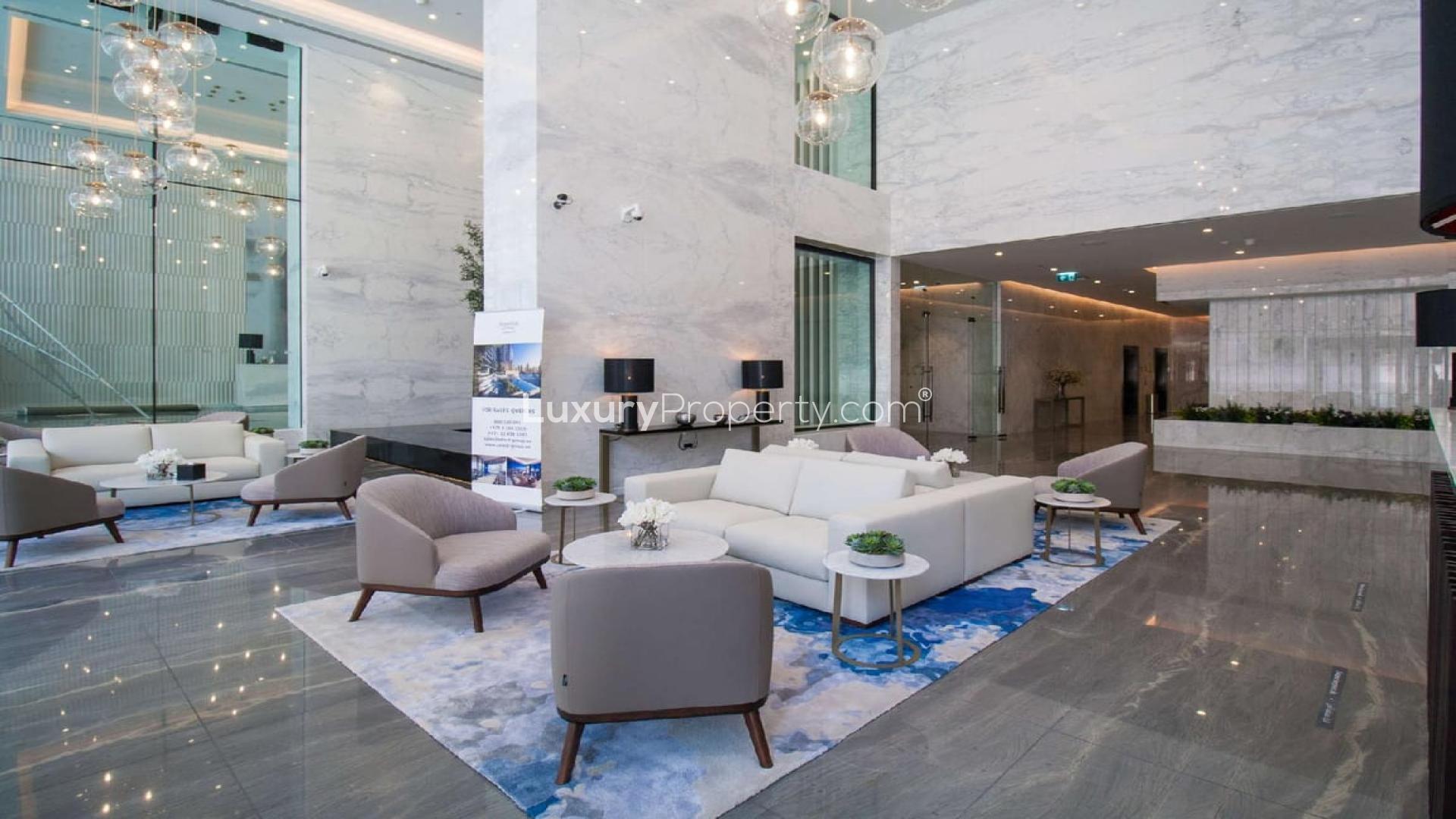 Elegant lobby of Marina Gate apartment in Dubai Marina with modern seating and decor