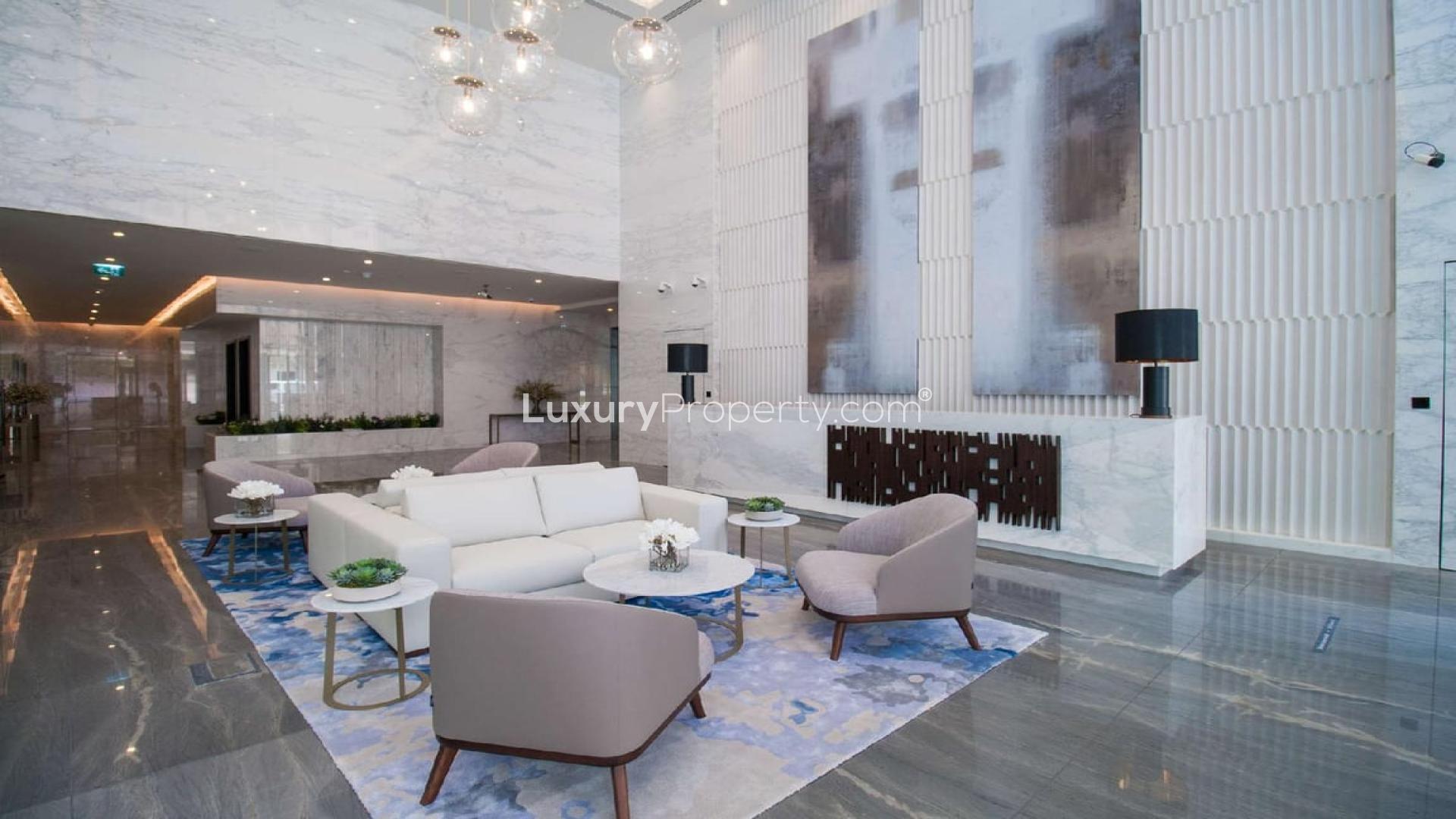 Modern kitchen and living area in one-bedroom apartment at Marina Gate, Dubai Marina