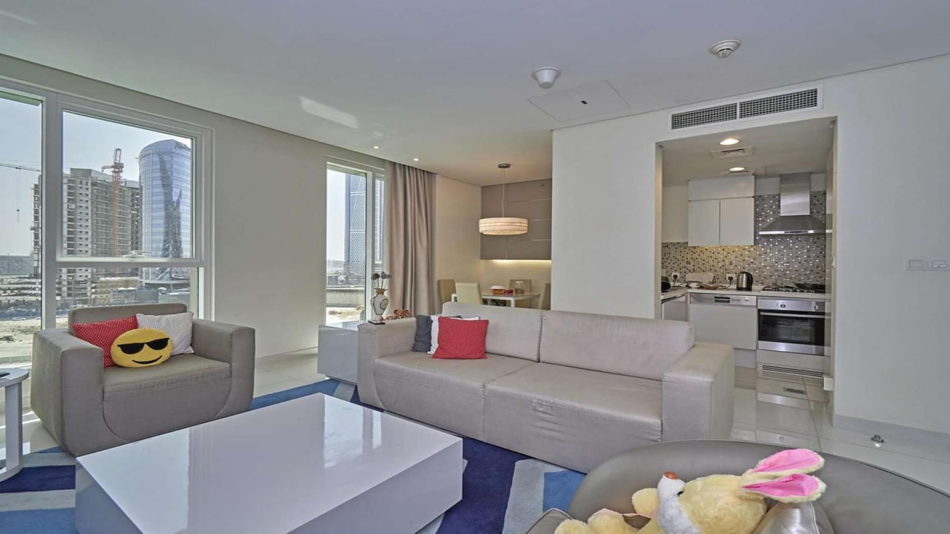 Skyline view of DAMAC Maison The Vogue, Business Bay, Dubai with canal and bridge