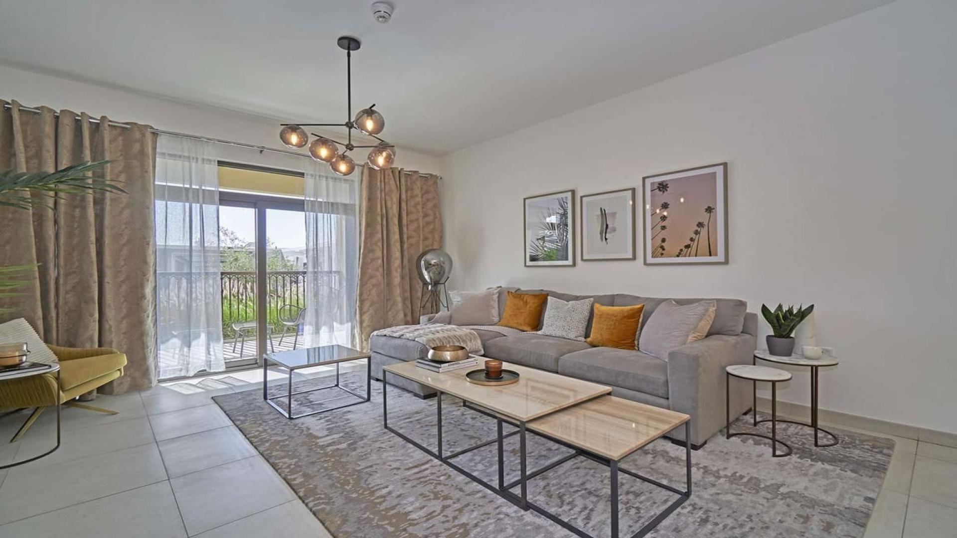 Modern bedroom in Madinat Jumeirah Living apartment for sale, featuring stylish decor and lighting