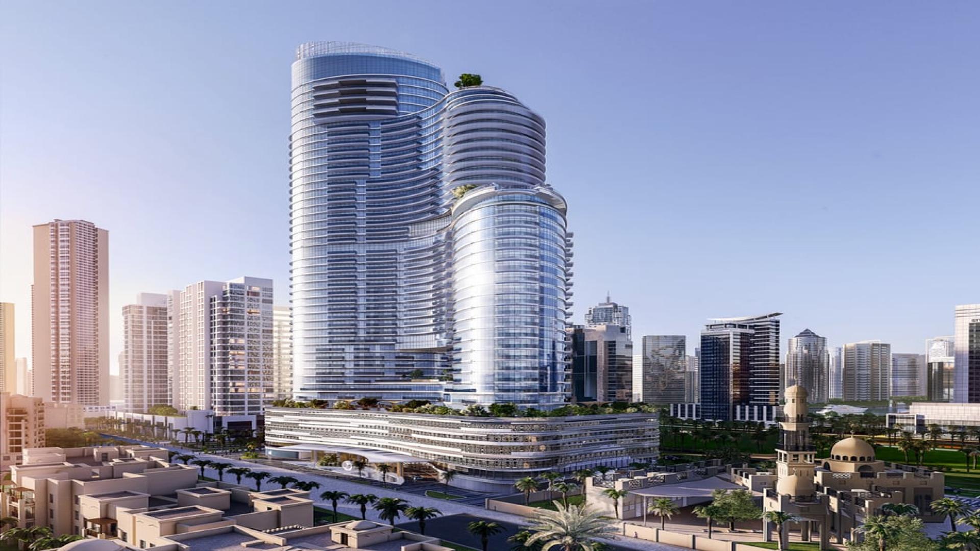 Luxury apartment balcony view with greenery, gym, and skyline in Imperial Avenue, Downtown Dubai