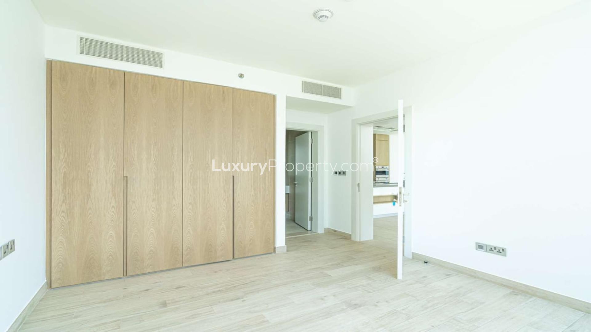 Modern kitchen with large windows in one-bed Serenia Residence apartment, Palm Jumeirah