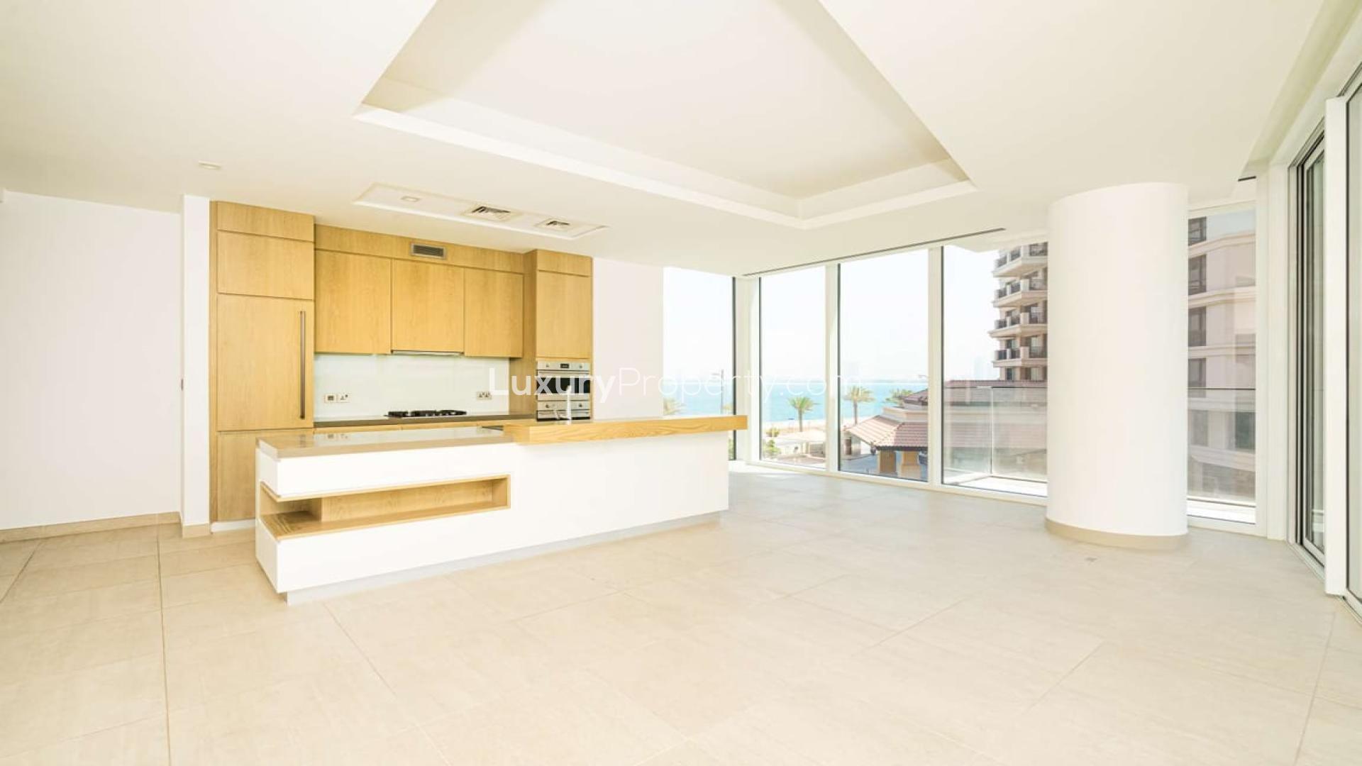 "Modern kitchen with island, large windows in Serenia Residence, Palm Jumeirah apartment.",Modern kitchen with ocean view in Serenia Residence, Palm Jumeirah apartment for sale