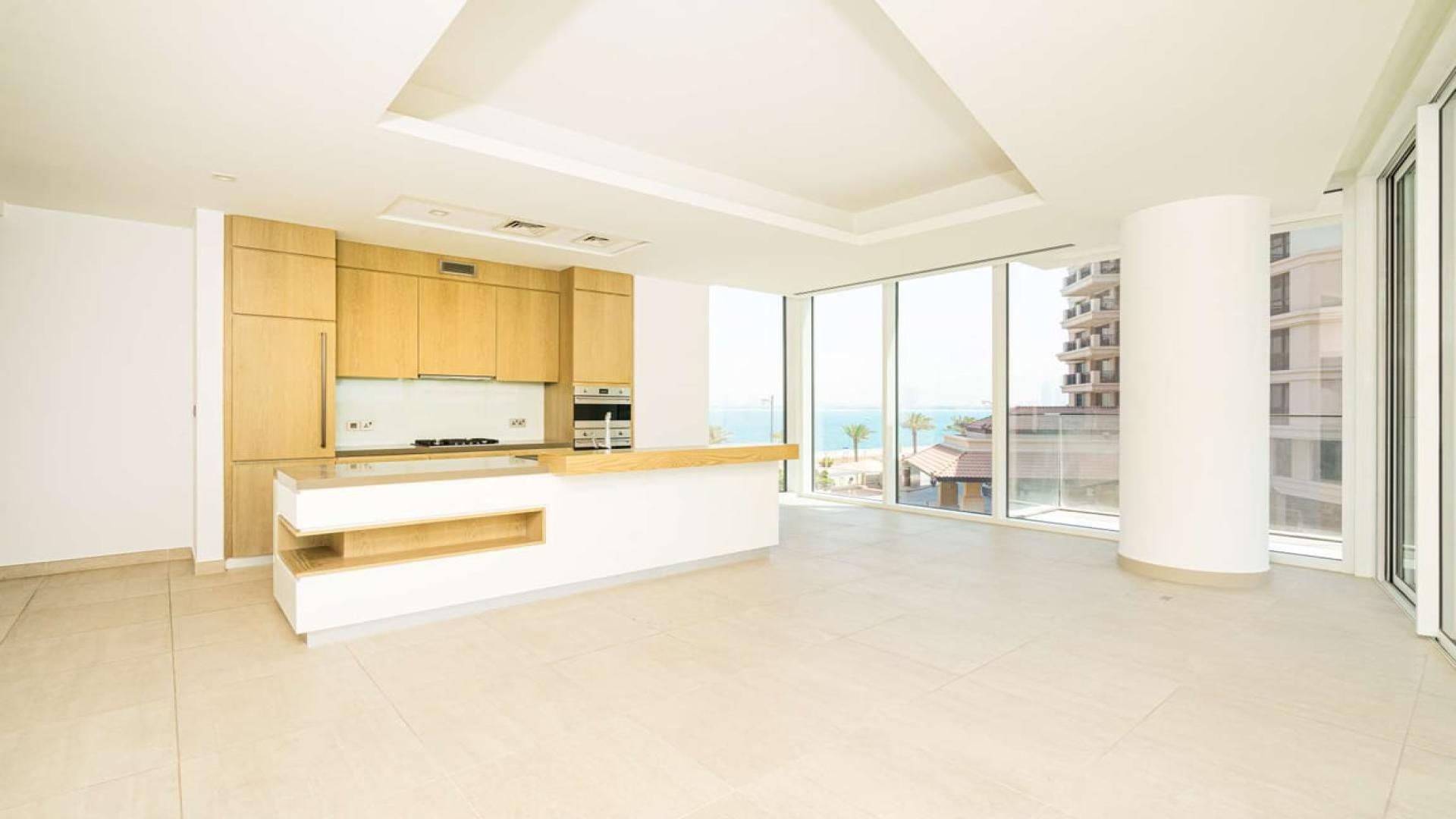 "Modern kitchen with island, large windows in Serenia Residence, Palm Jumeirah apartment.",Modern kitchen with ocean view in Serenia Residence, Palm Jumeirah apartment for sale