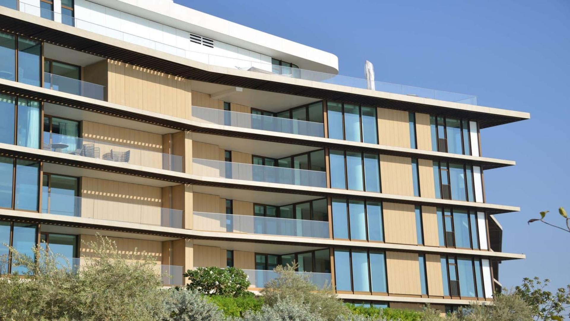 Bright living area with wooden floors in Bulgari Residences, Jumeirah Bay Island apartment