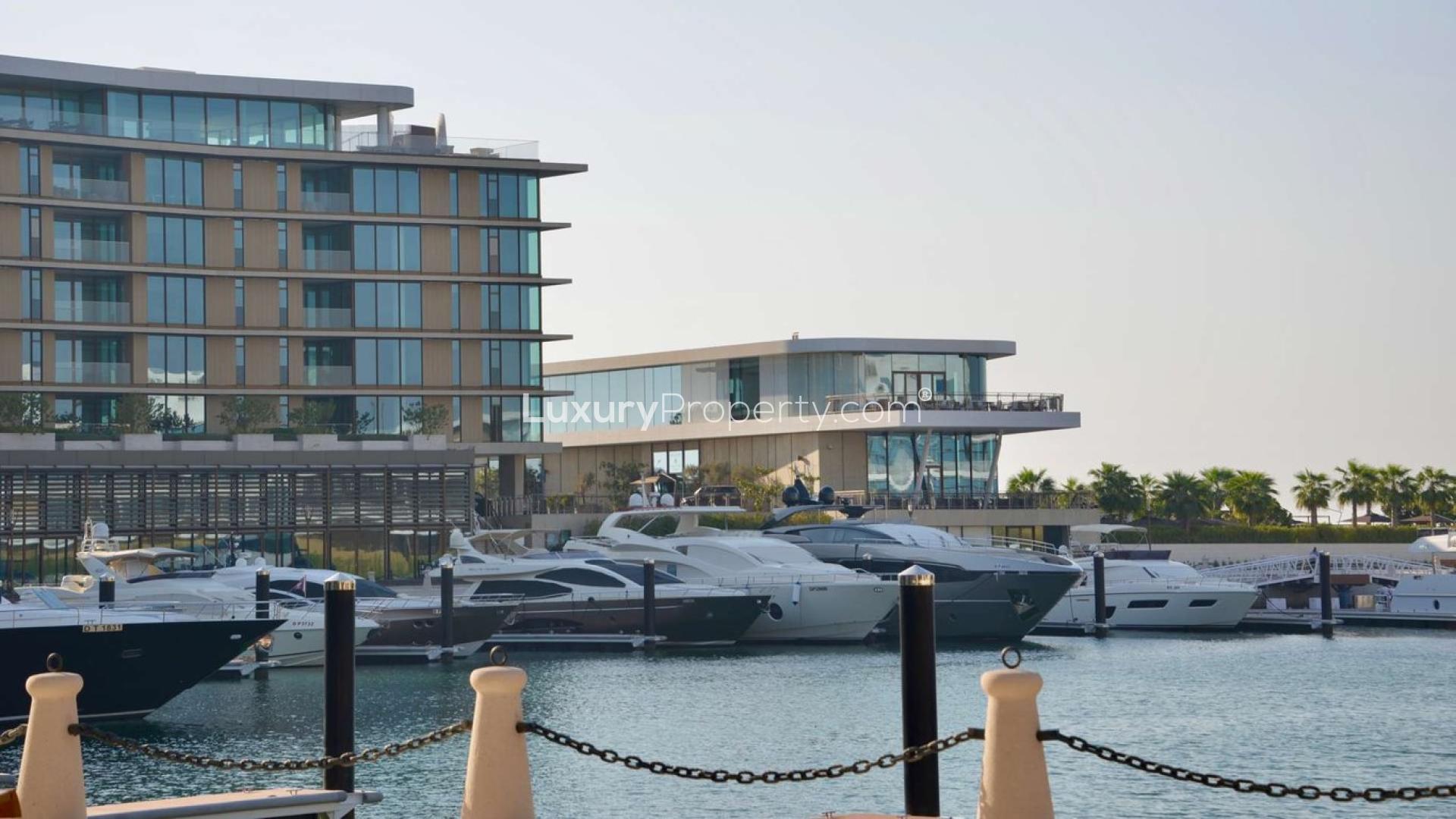 Exterior view of Bulgari Residences apartment on Jumeirah Bay Island, Dubai skyline visible