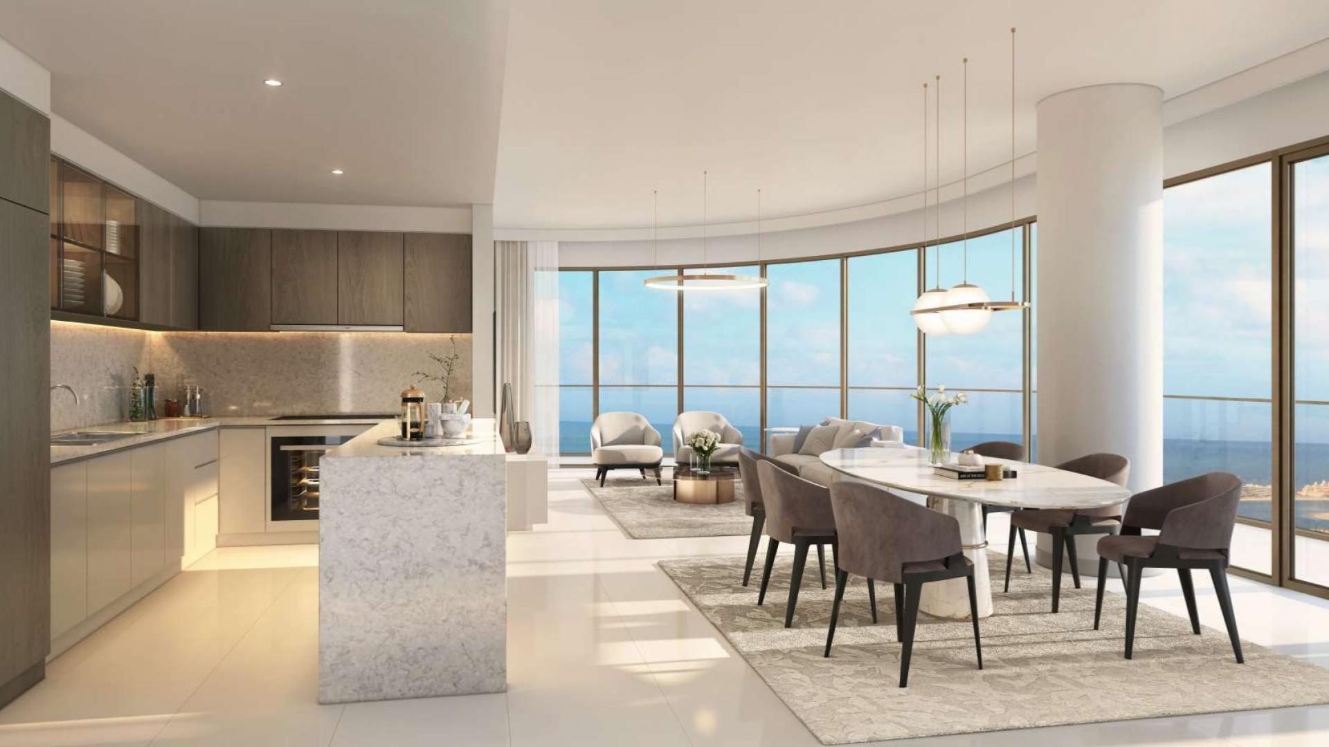 "Luxury apartment pool view at Emaar Beachfront, Dubai Harbour. Ref No: LP06929.",Modern open-plan kitchen and dining area with sea view in Emaar Beachfront apartment