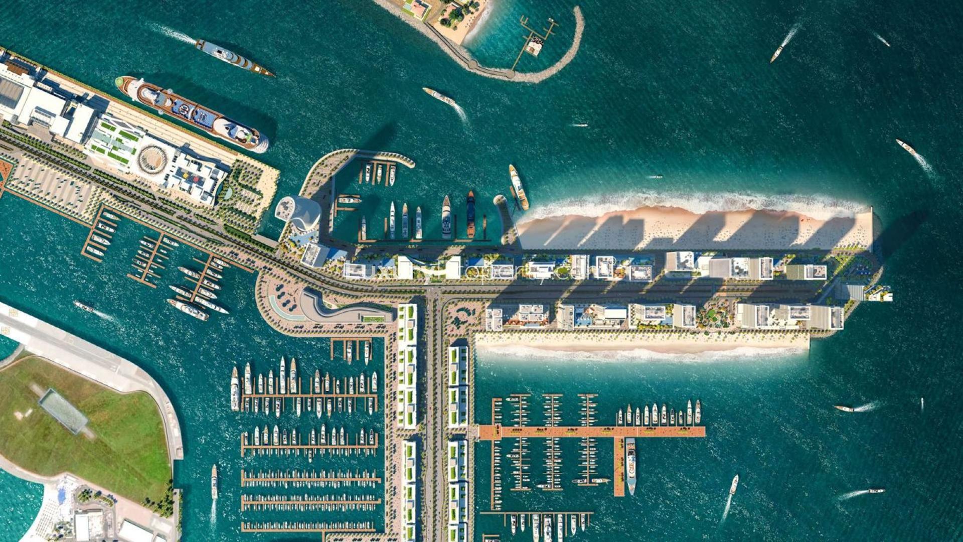 Aerial view of Dubai Harbour's Emaar Beachfront, showcasing luxury beachfront apartments and marina