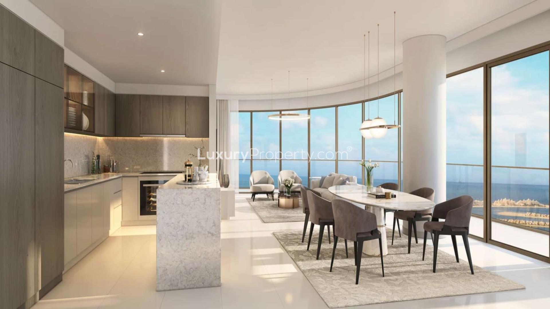 "Luxury apartment balcony with stunning Palm and sea views at Emaar Beachfront, Dubai Harbour.",Modern kitchen and dining area in Dubai Harbour apartment with sea views