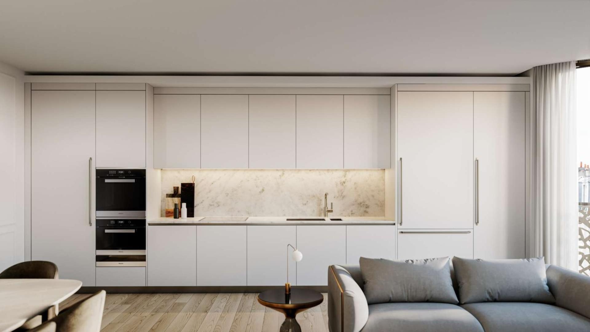 Modern kitchen with marble countertops in stylish W1 Place apartment, London